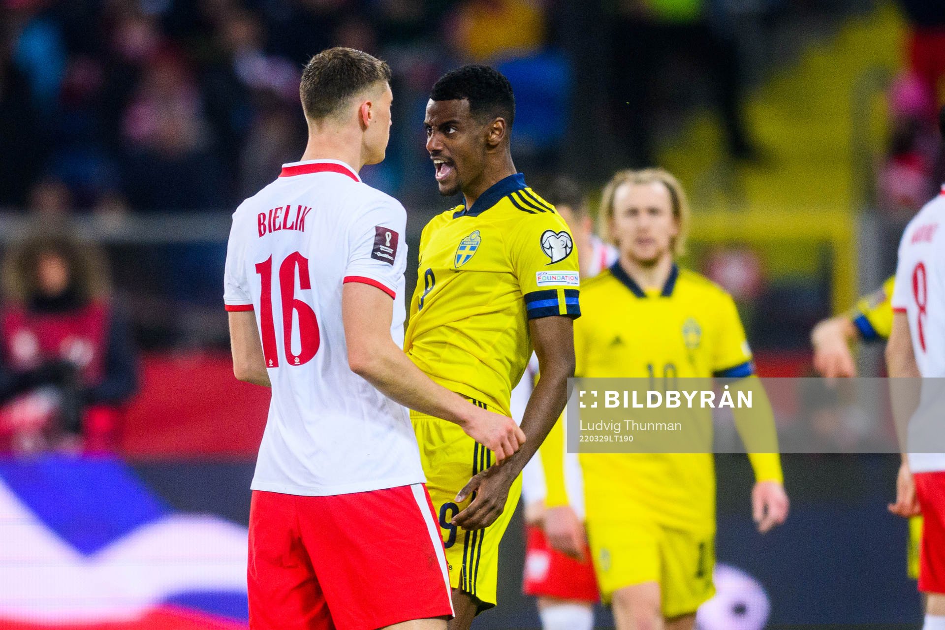 Krystian Bielik of Poland and Alexander Isak of Sweden