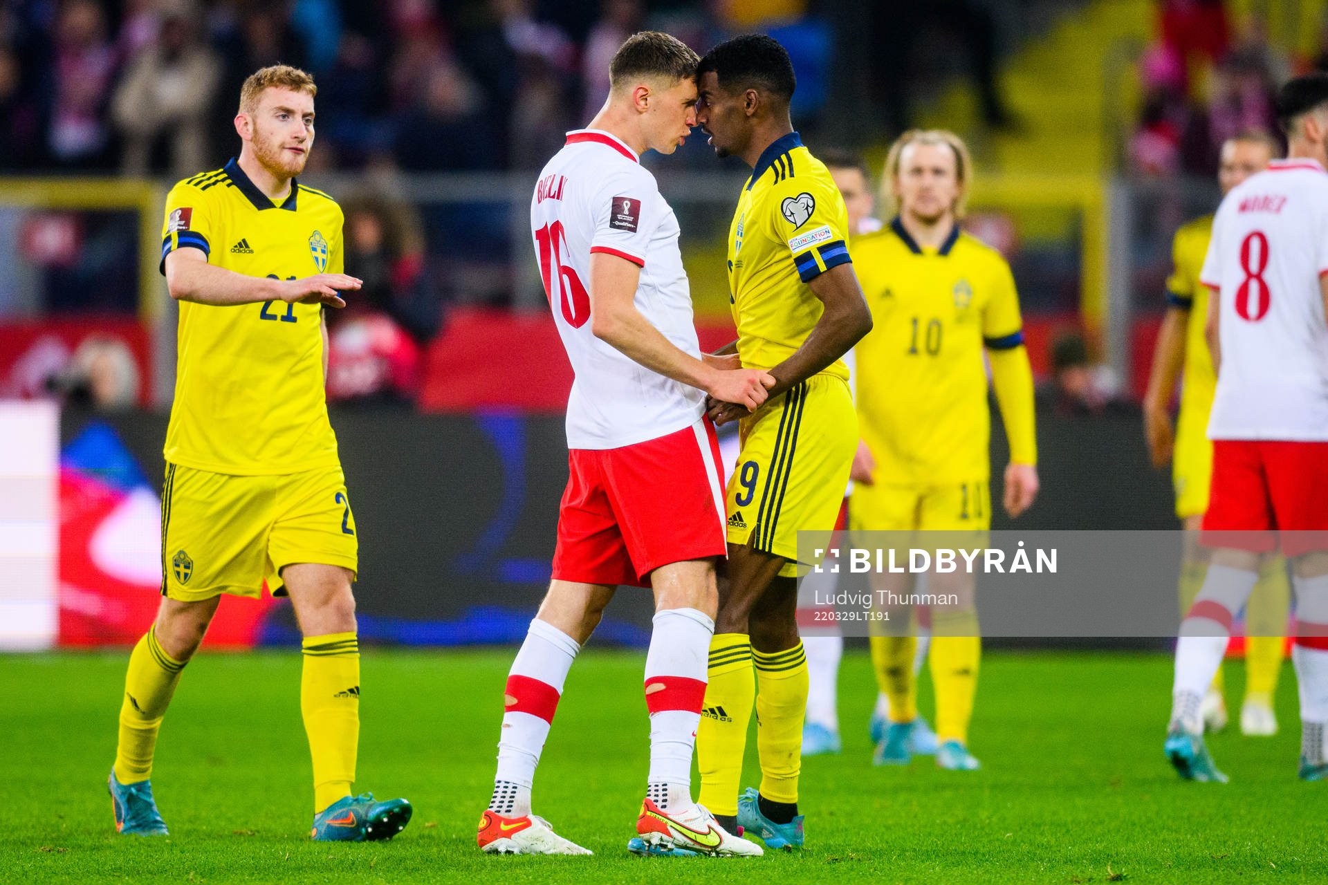Krystian Bielik of Poland and Alexander Isak of Sweden