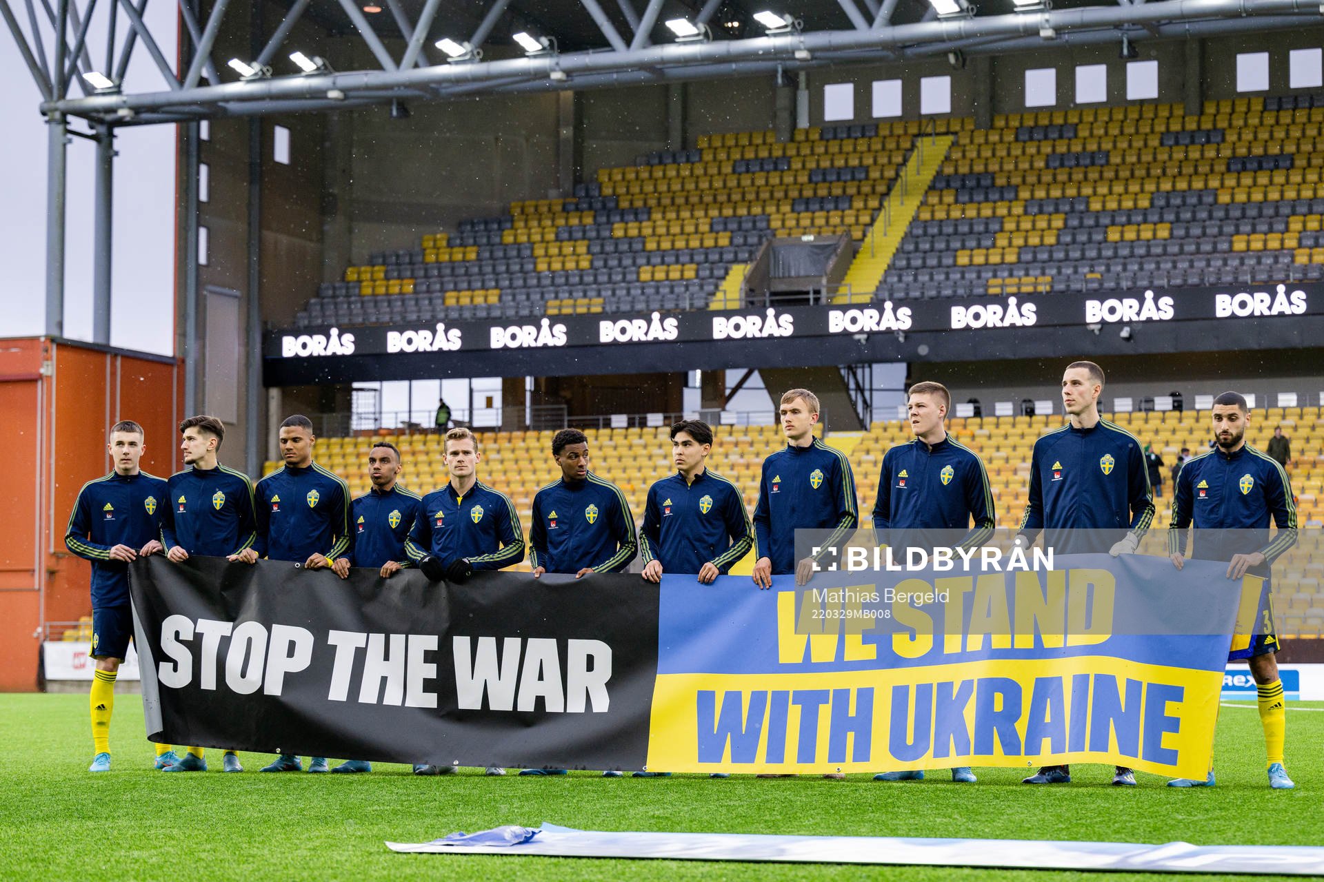 Players of Sweden with a banner
