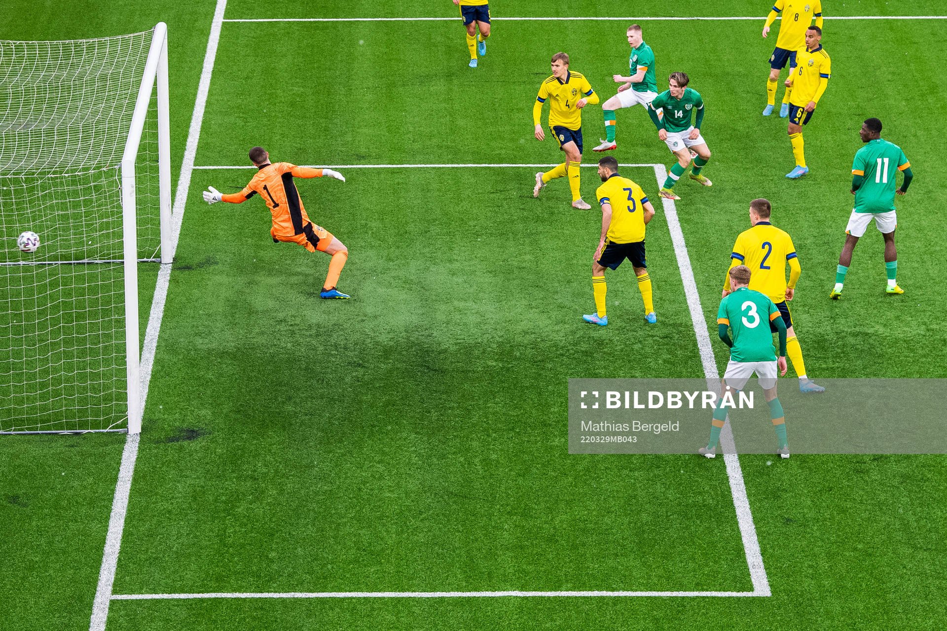 Ross Tierney of Ireland scores 0-1 behind goalkeeper Samuel