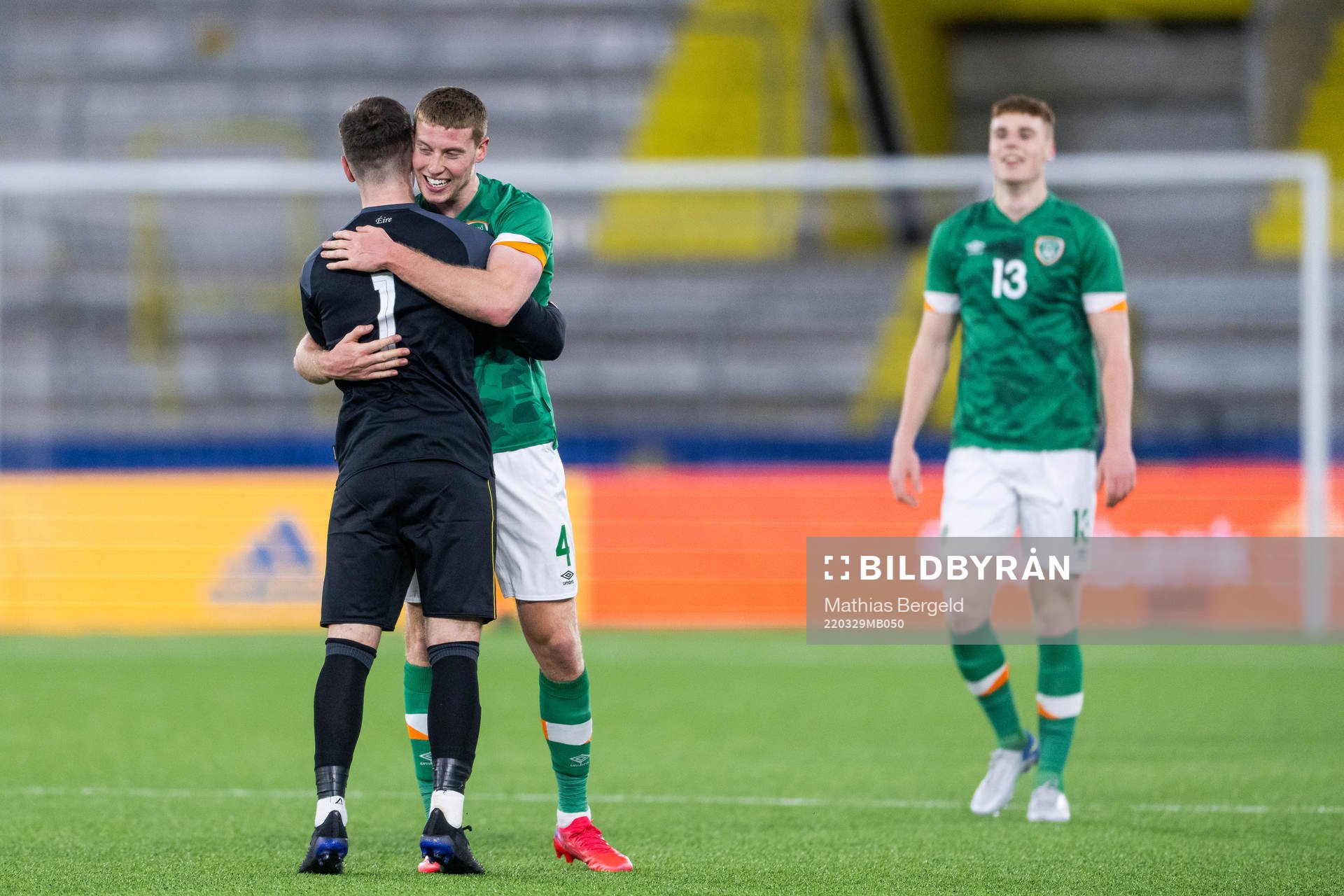 goalkeeper Brian Maher and Mark McGuinness of Ireland