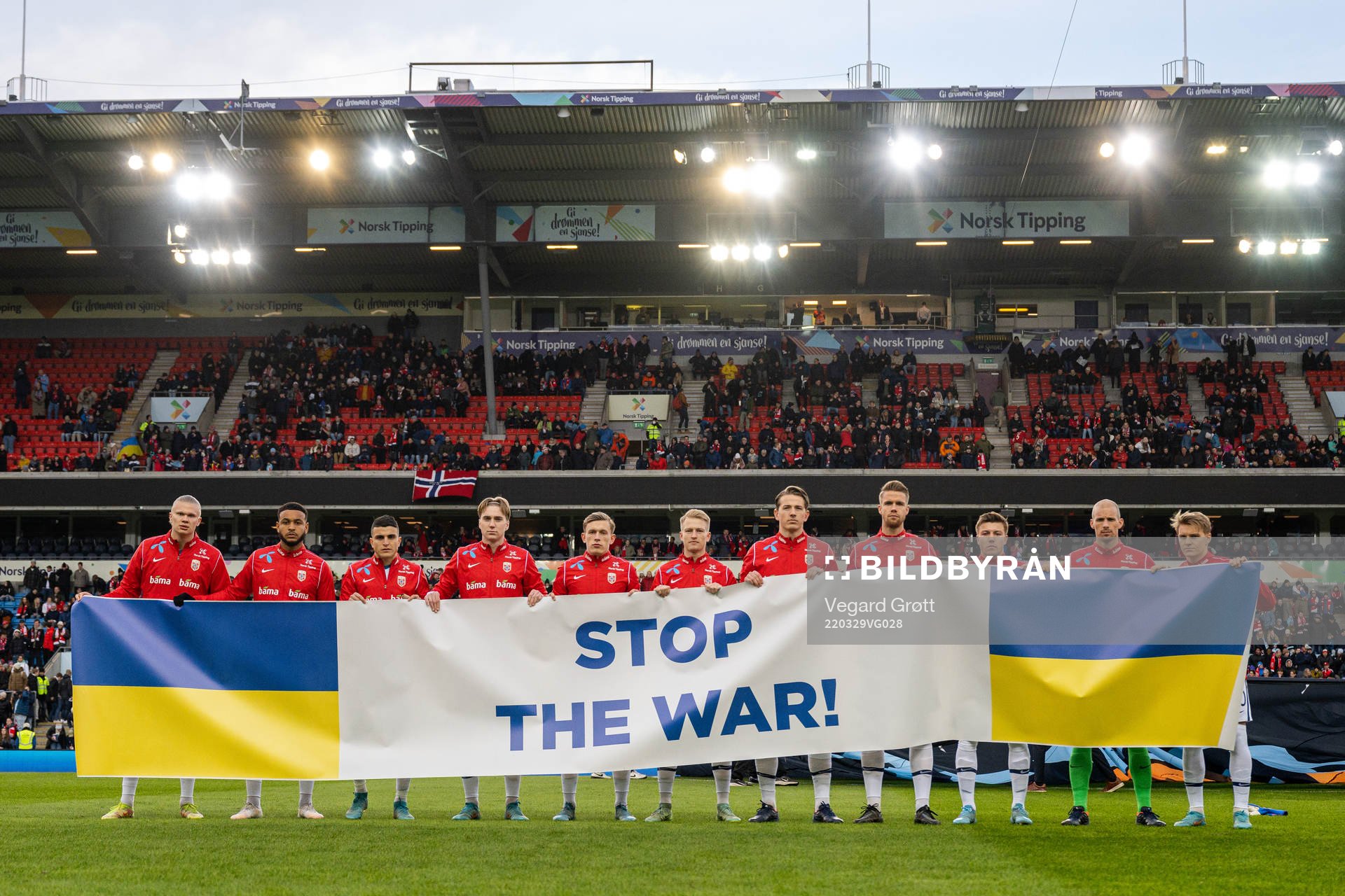 Players of Norway with a banner
