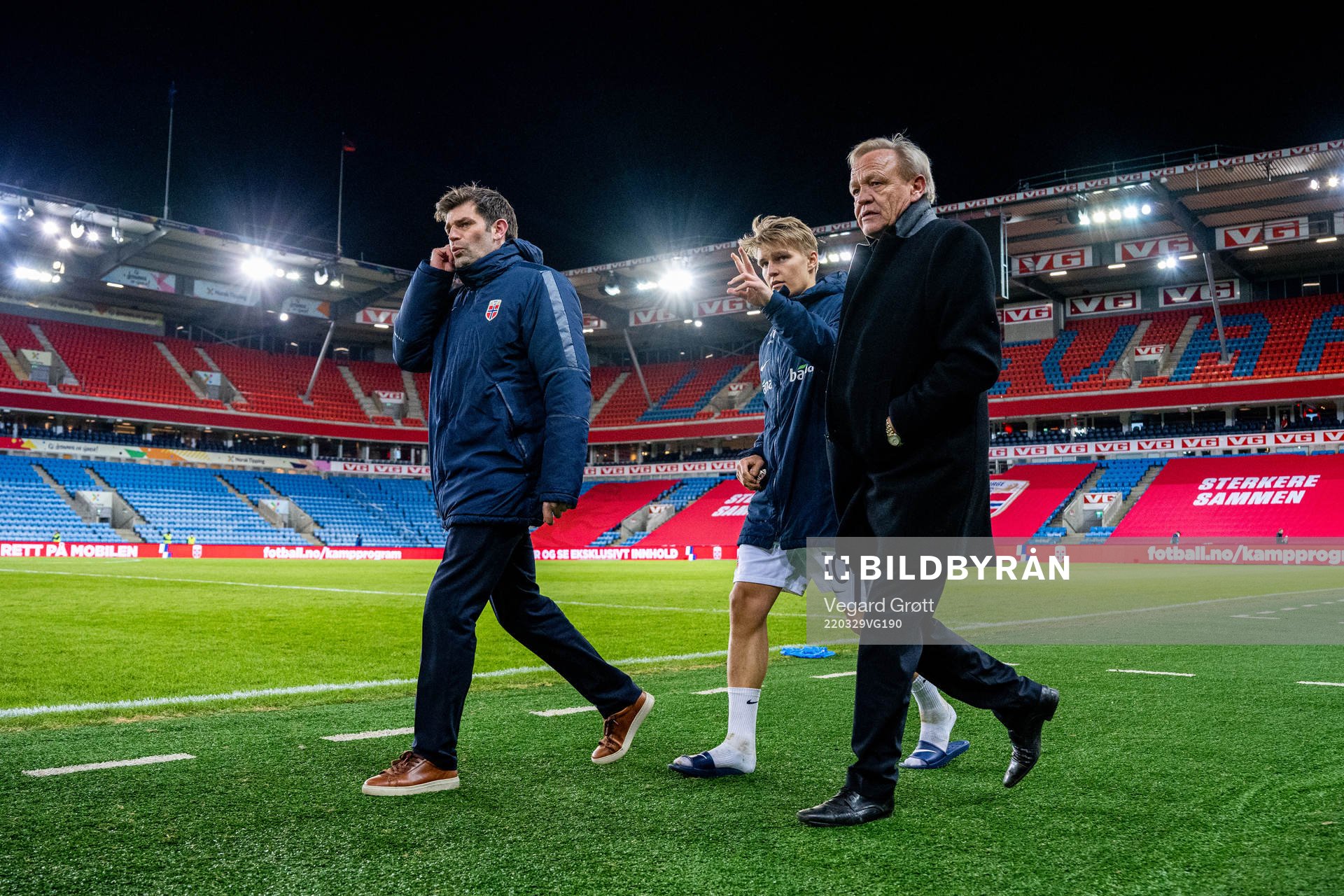Morten Morisbak Skjønsberg, press officer, Martin Ødegaard of Norway and Geir Ellefsen, head of security, after the international friendly football match between Norway and Armenia on March 29, 2022 in Oslo.