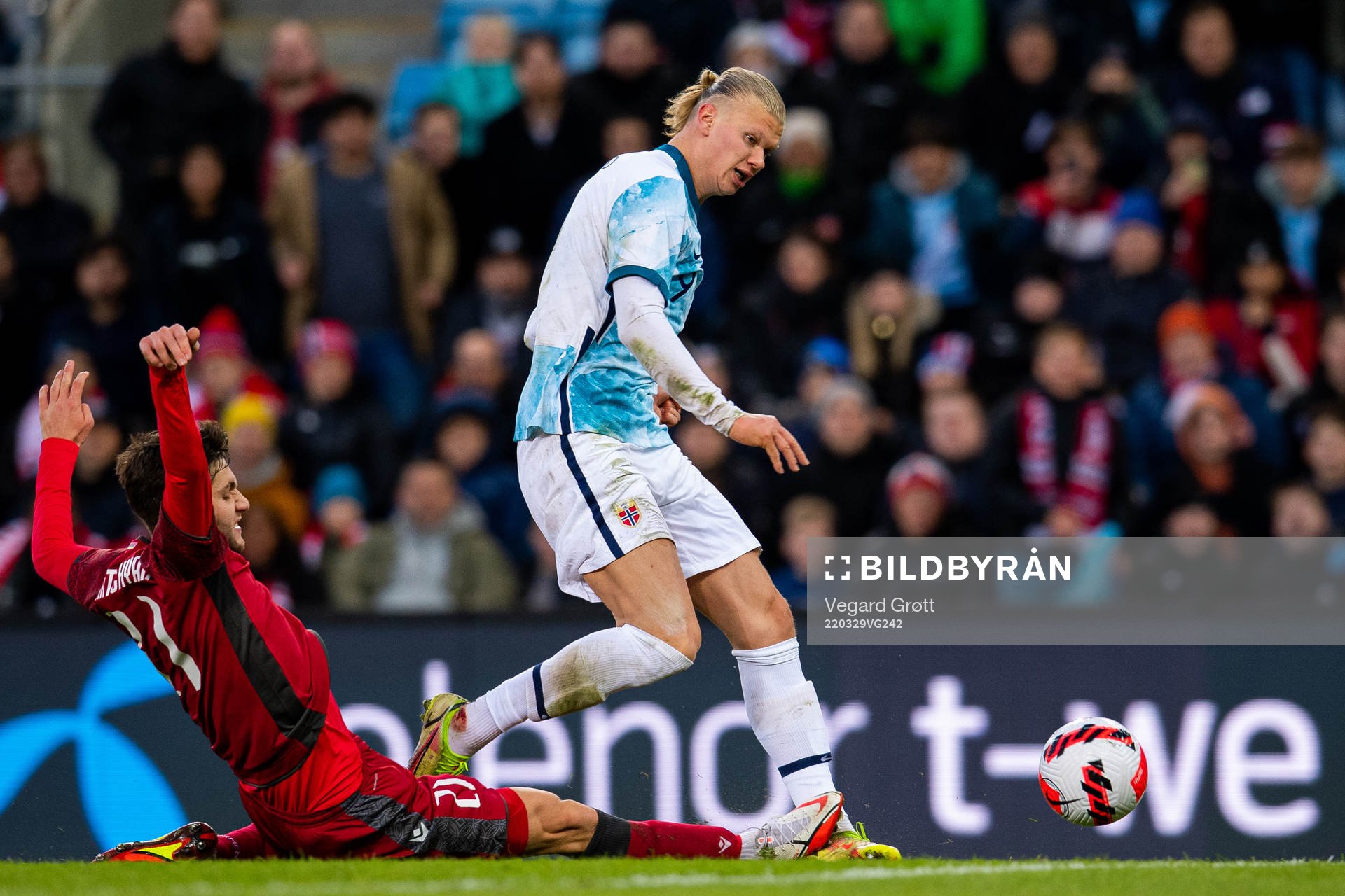 Erling Braut Haaland of Norway is being tackled by Styopa