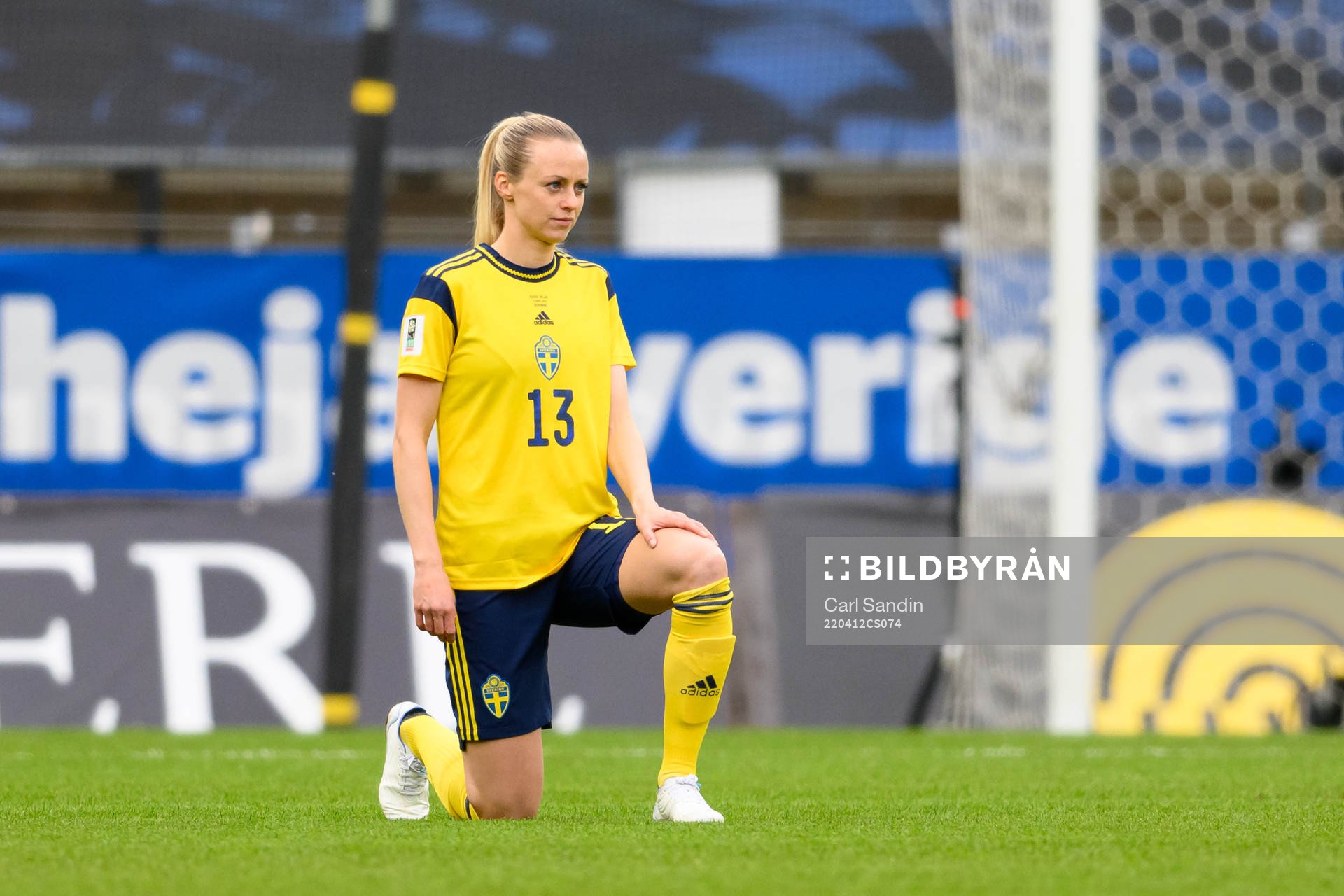 Amanda Ilestedt of Sweden takes a knee in support of the