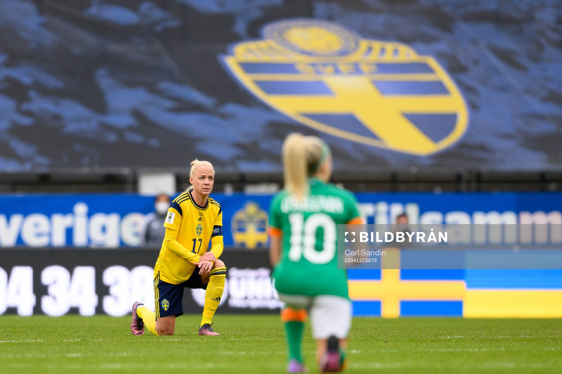 Caroline Seger of Sweden takes a knee in support of the
