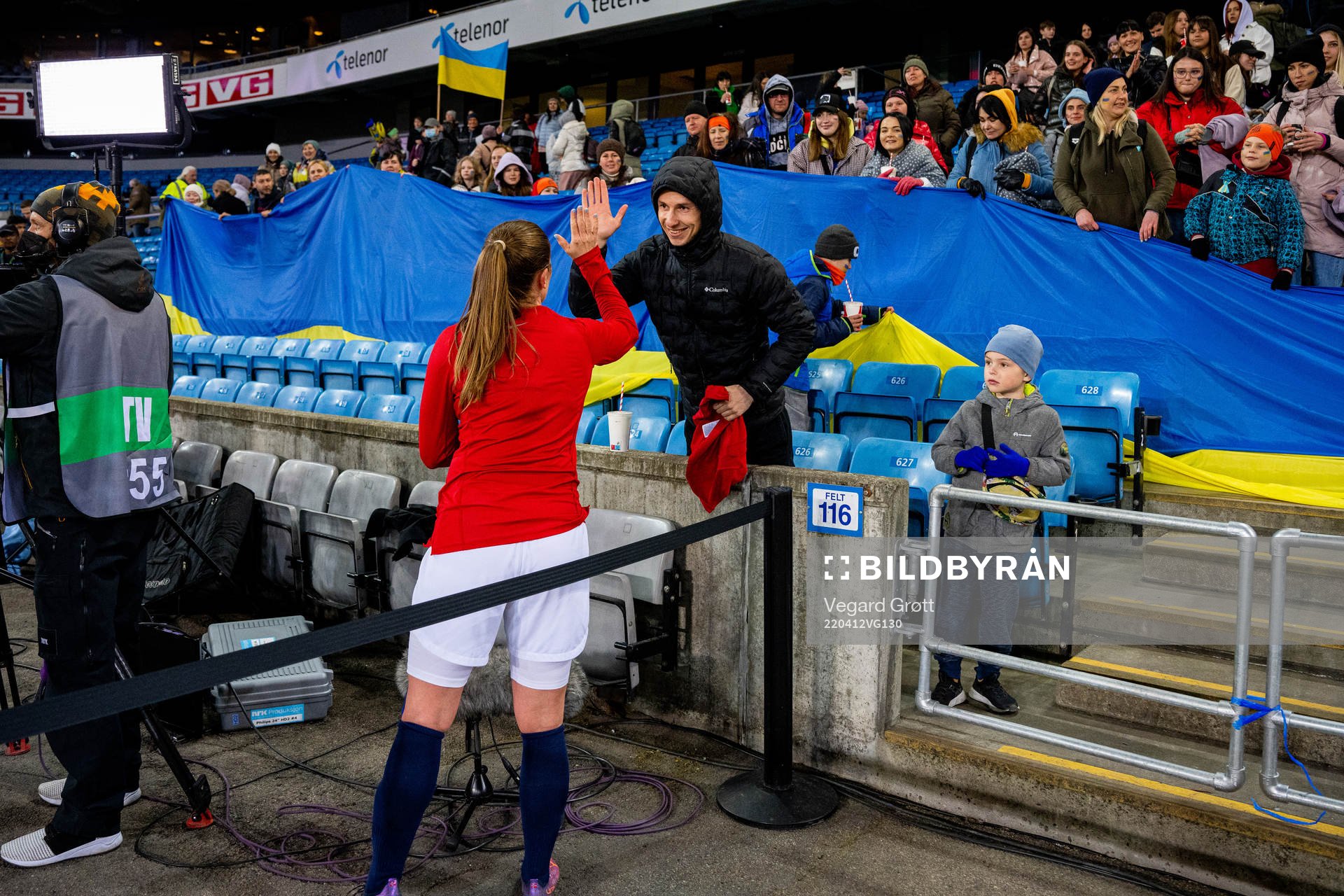 Maren Mjelde of Norway gives her kit to a supporter in the