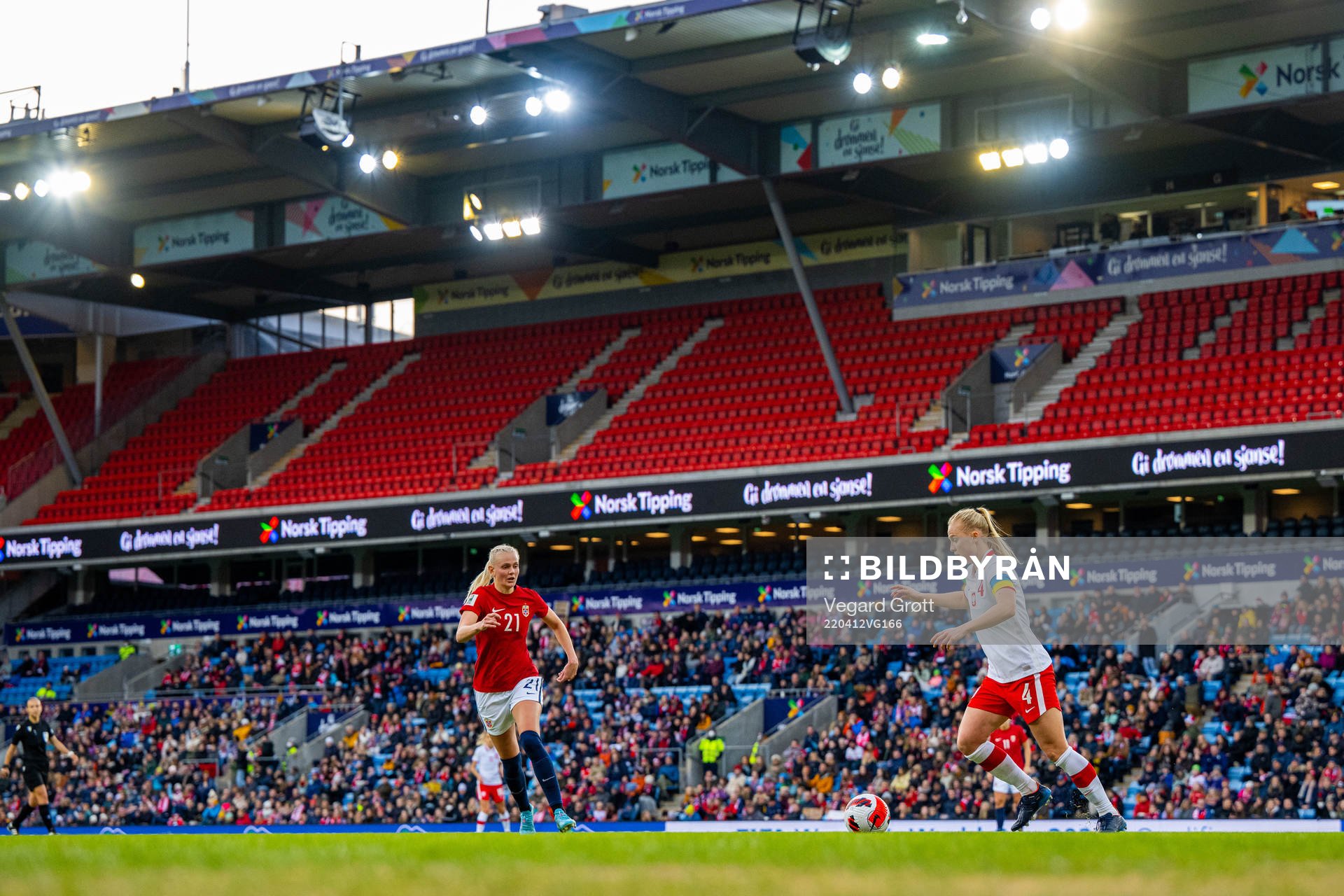 Karina Sævik of Norway and Paulina Dudek of Poland during the FIFA Women's World Cup Qualifier football match between Norway and Poland on April 12, 2022 in Oslo. 