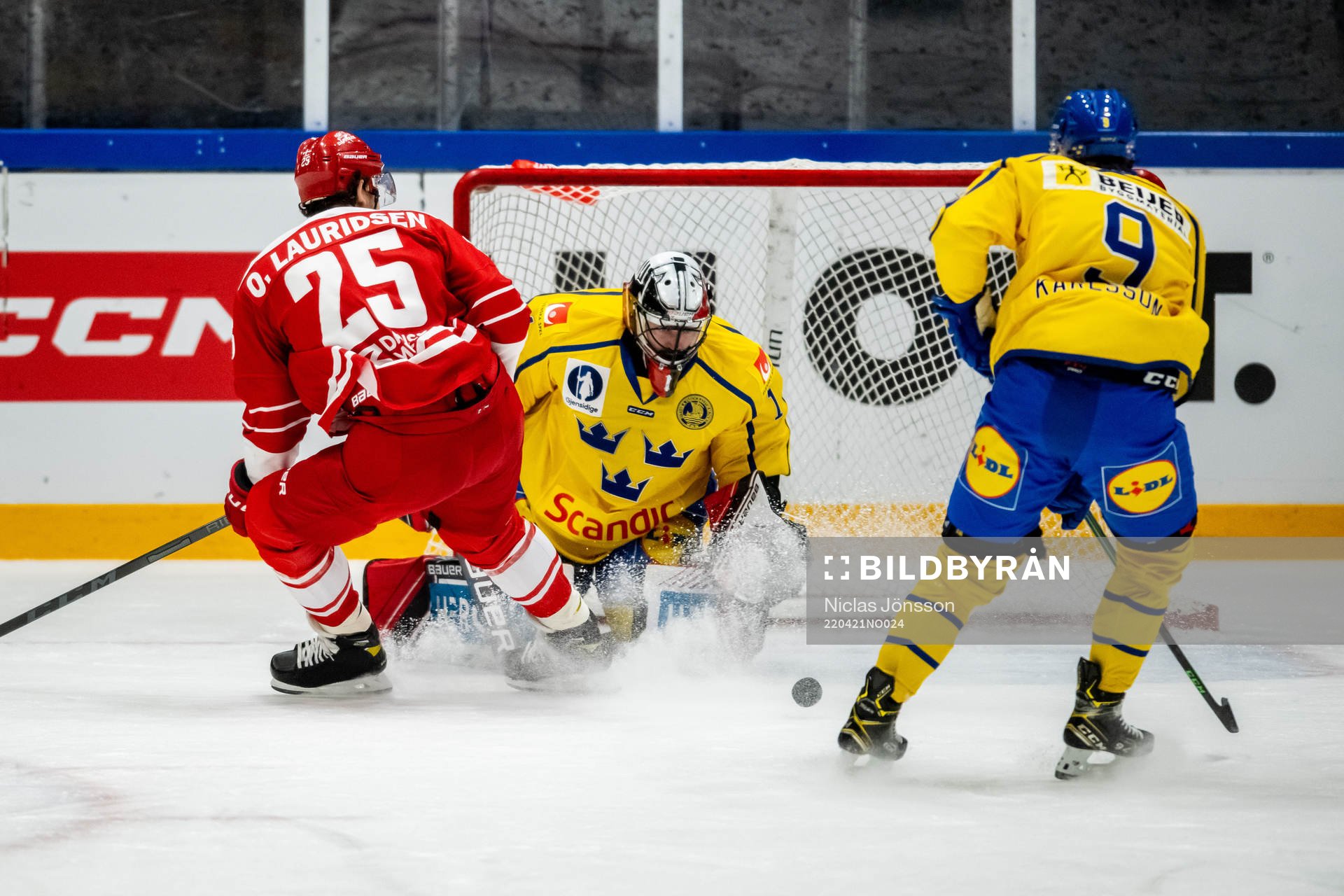 Oliver Lauridsen of Denmark and goalkeeper Jhonas Enroth of
