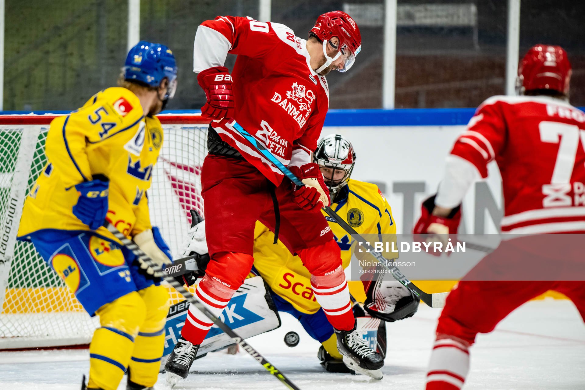 Mathias Bau Hansen of Denmark and goalkeeper Jhonas Enroth