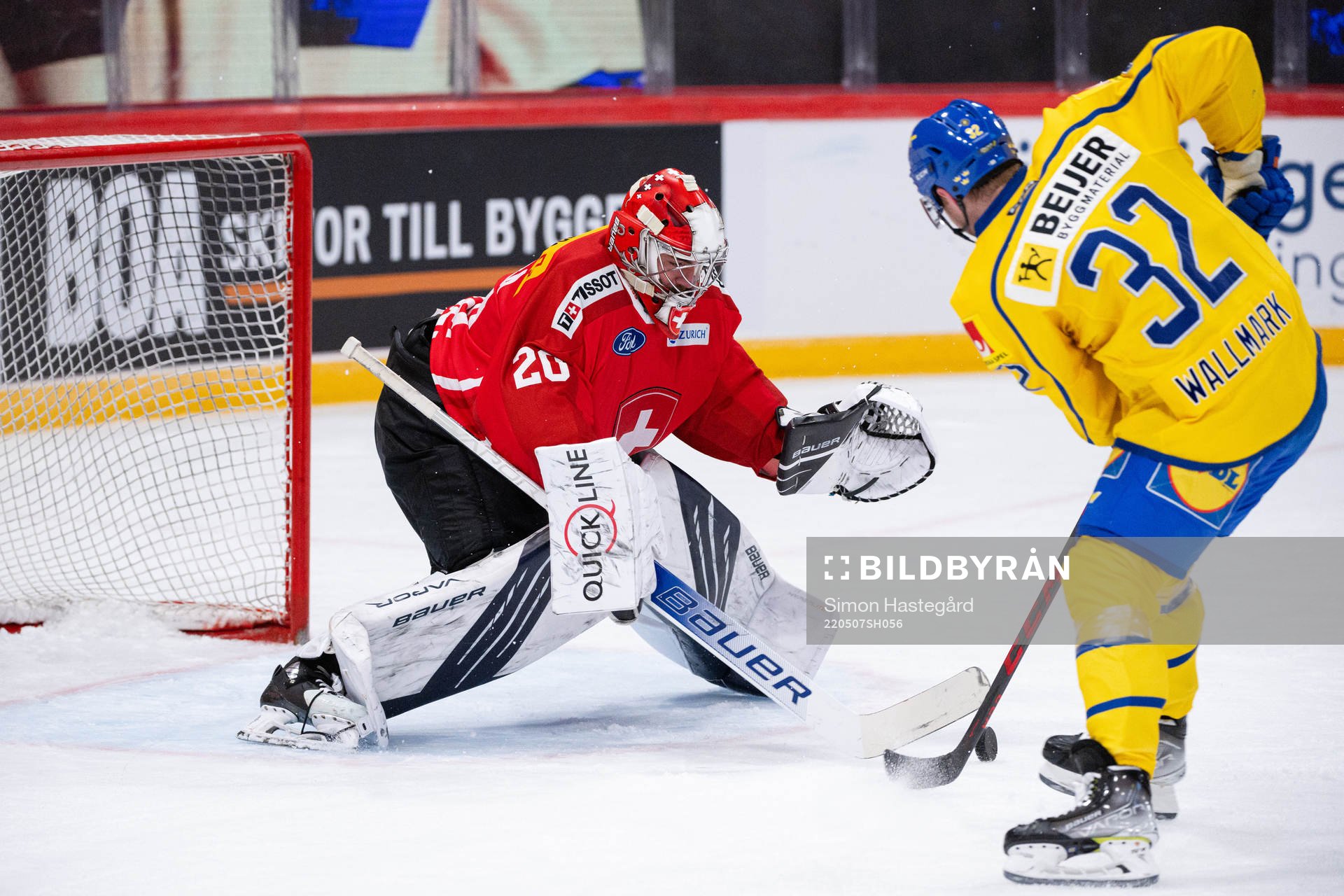 Lucas Wallmark of Sweden against goalkeeper Reto Berra of