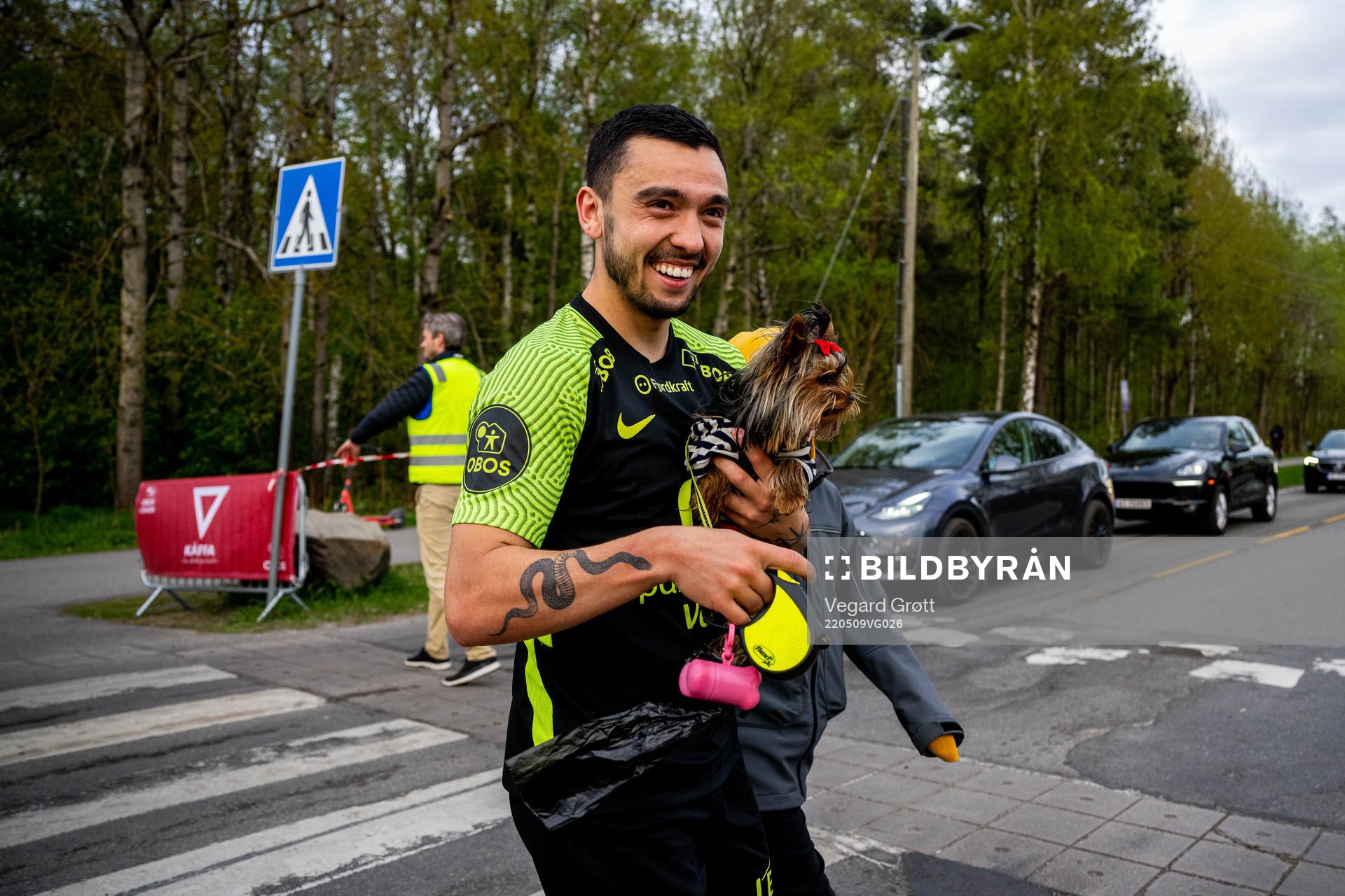 Niklas Castro of Brann with a dog