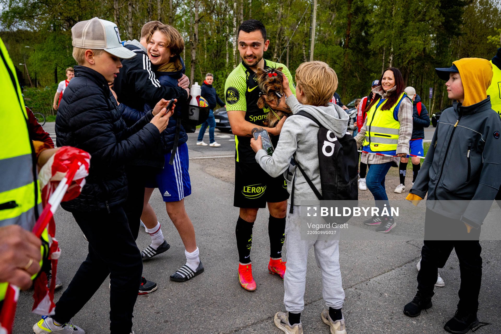 Niklas Castro of Brann with a dog
