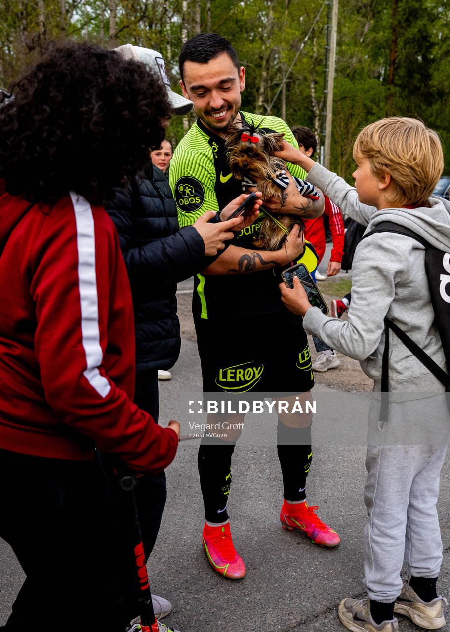 Niklas Castro of Brann with a dog