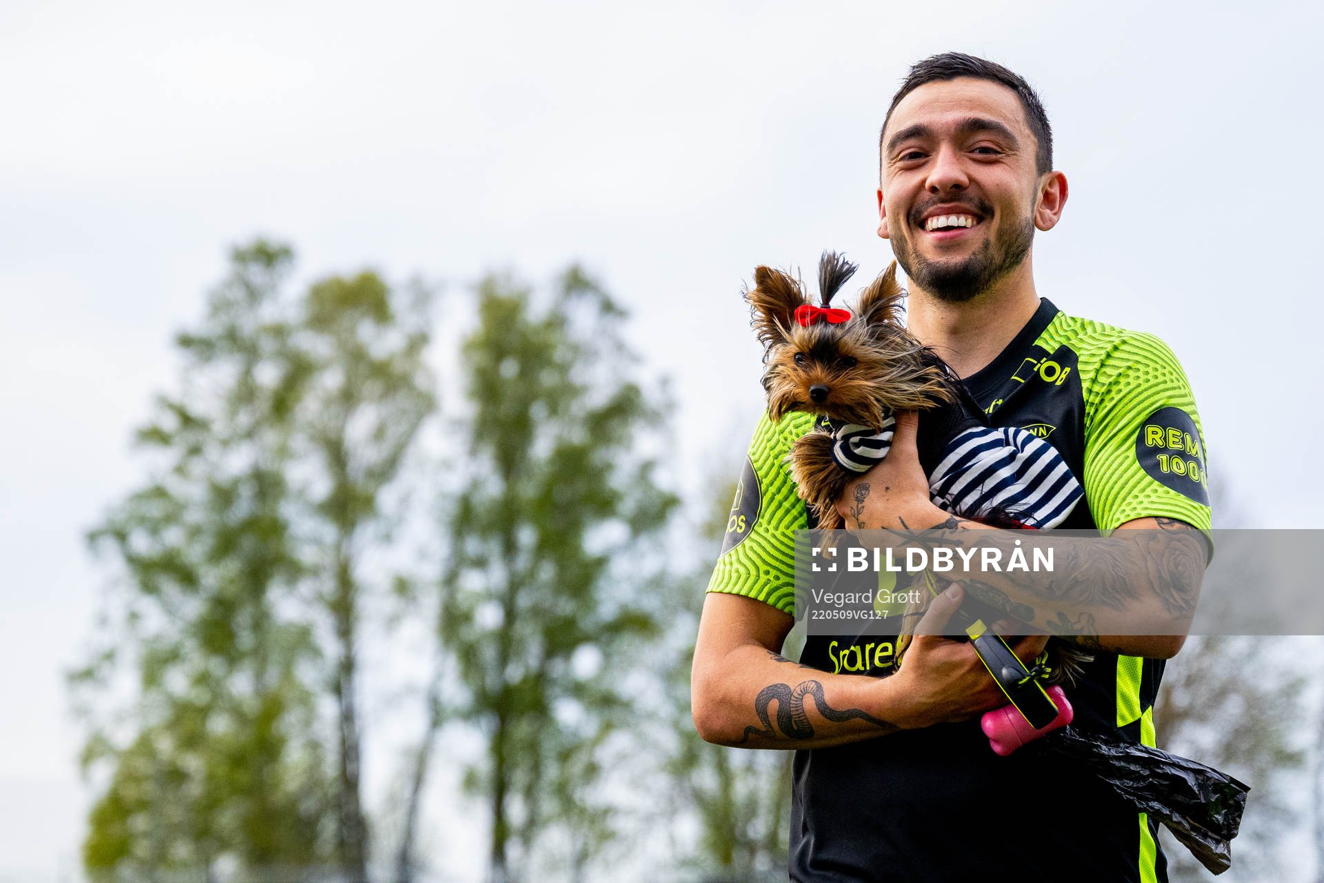 Niklas Castro of Brann with a dog