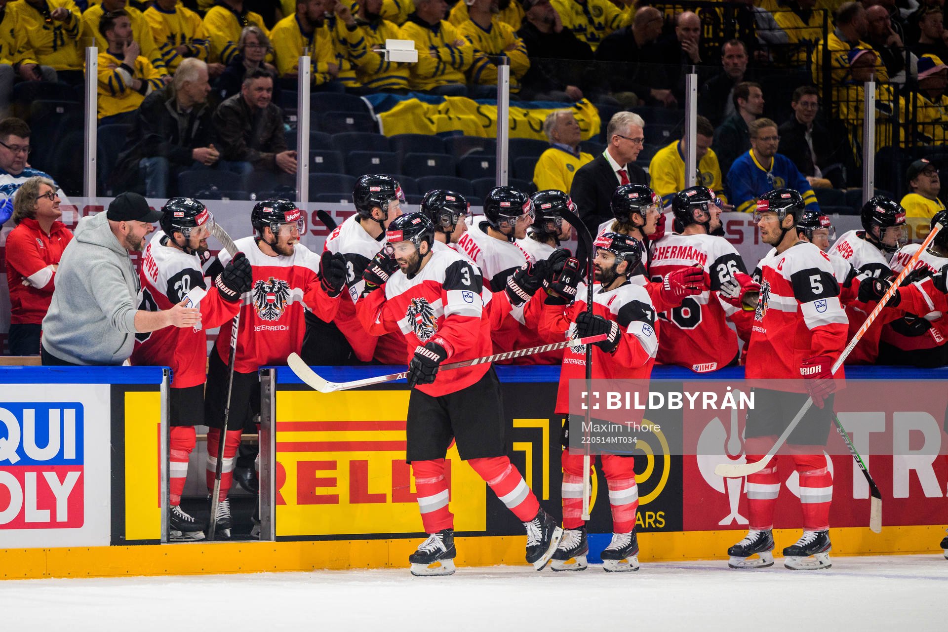 Peter Schneider of Austria celebrate with teammates
