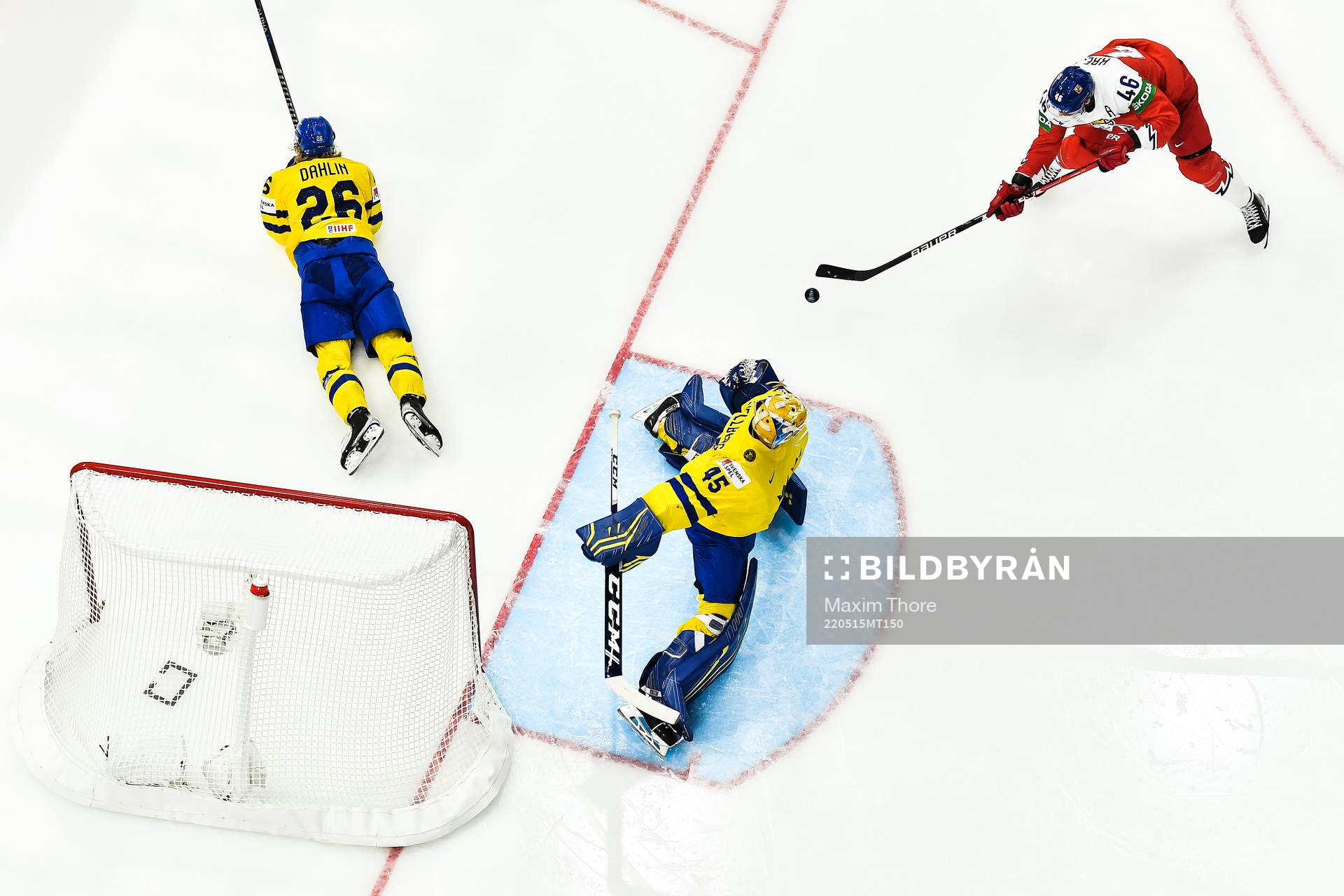 goaltender Magnus Hellberg of Sweden and Rasmus Dahlin of