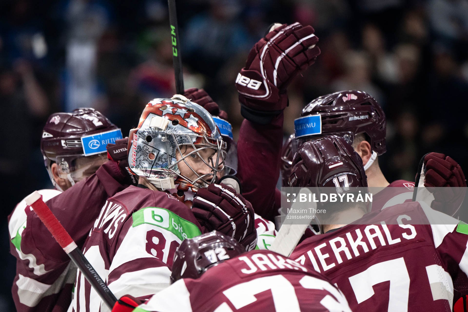 Goaltender Elvis Maerzlikins of Latvia celebrate with