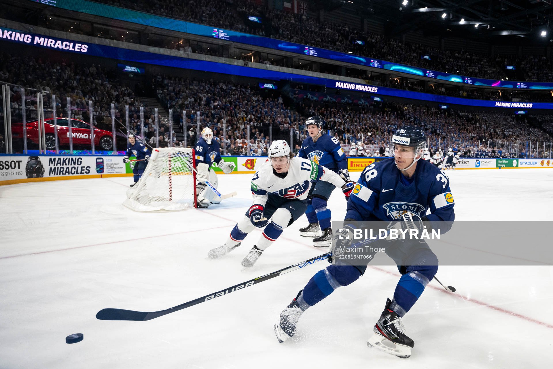Adam Gaudette of USA and Jusso Hietanen of Finland
