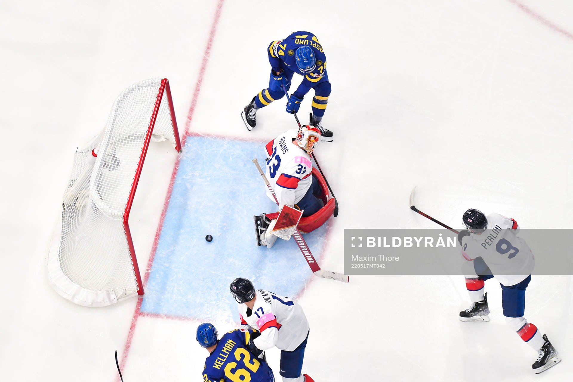 Rasmus Asplund of Sweden scores the 1-0 goal behind