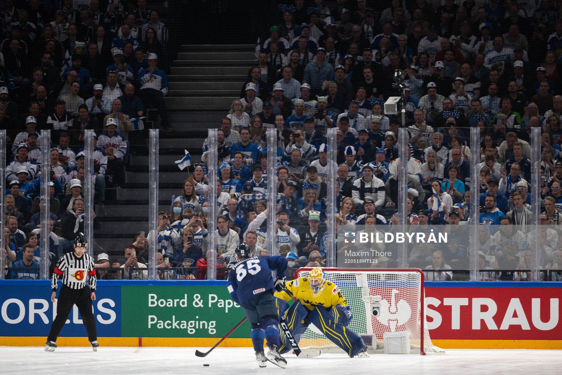 Sakari Manninen of Finland against goaltender Magnus