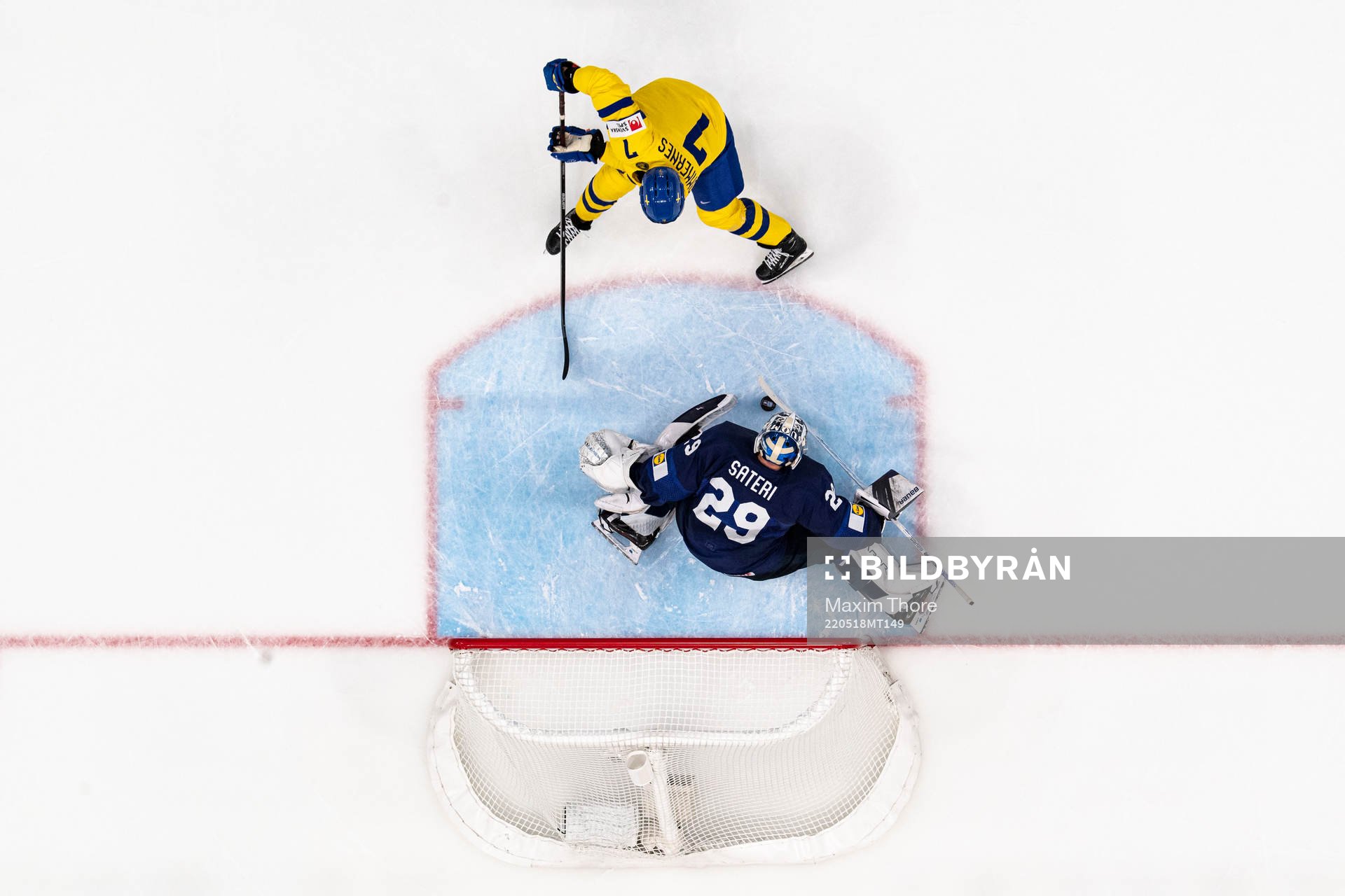 Henrik Tömmernes of Sweden and goaltender harri Säteri of