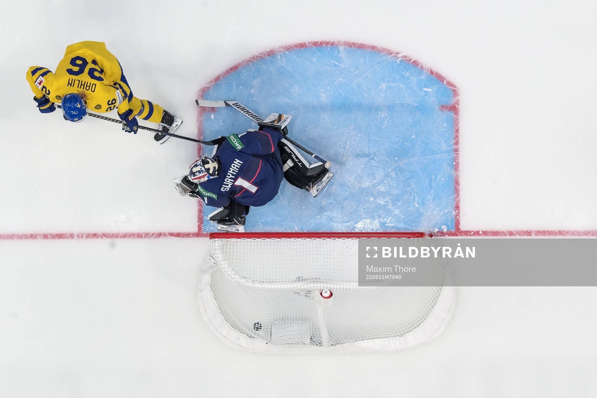 Rasmus Dahlin of Sweden scores 0-1 behind goaltender Jeremy