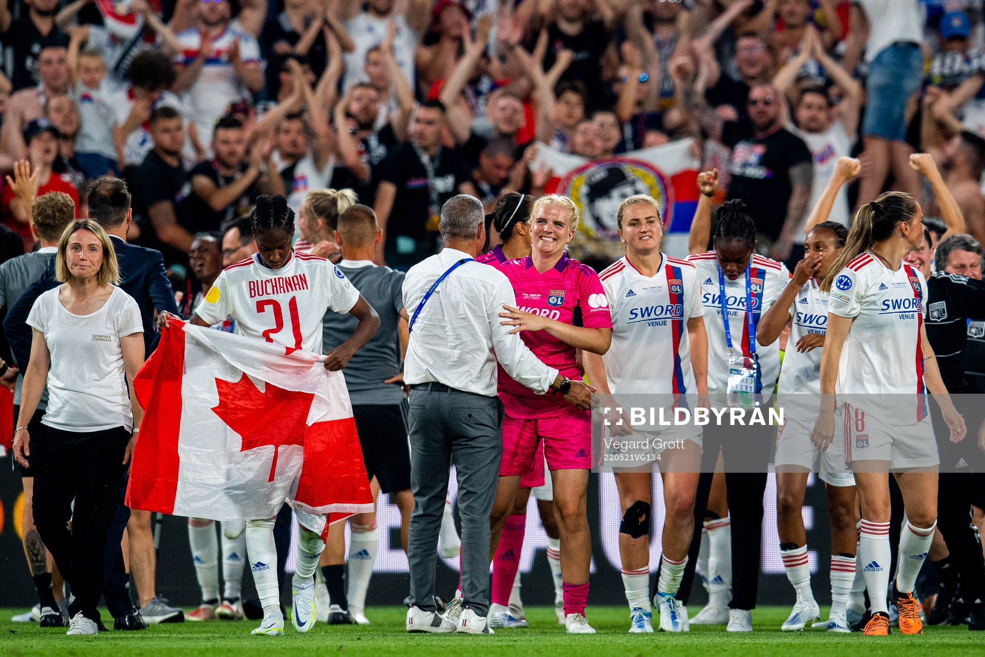 Goalkeeper Emma Holmgren of Lyon celebrates winning the