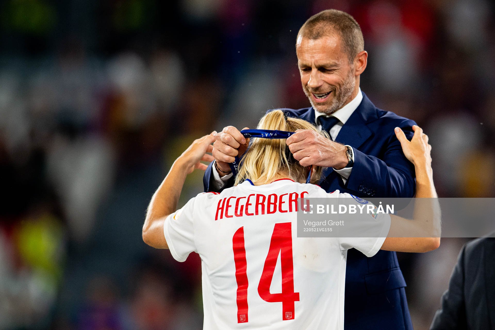 Ada Hegerberg of Lyon receives her winners medal by UEFA president Aleksander Ceferin after the UEFA Women's Champions League final match between Barcelona and Lyon on May 21, 2022 in Turin.