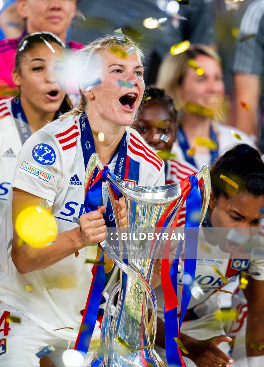 Ada Hegerberg of Lyon lifts the winners trophy