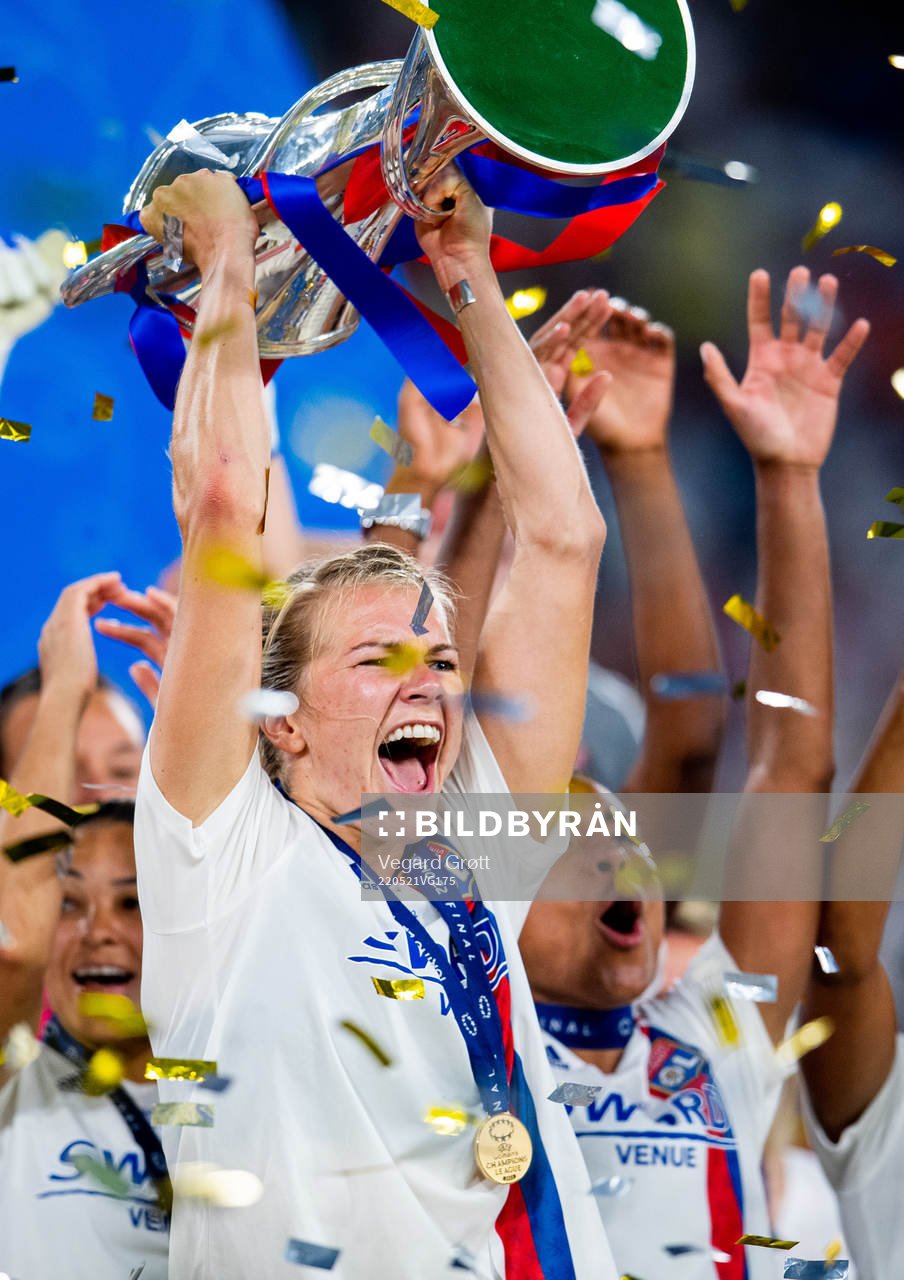 Ada Hegerberg of Lyon lifts the winners trophy