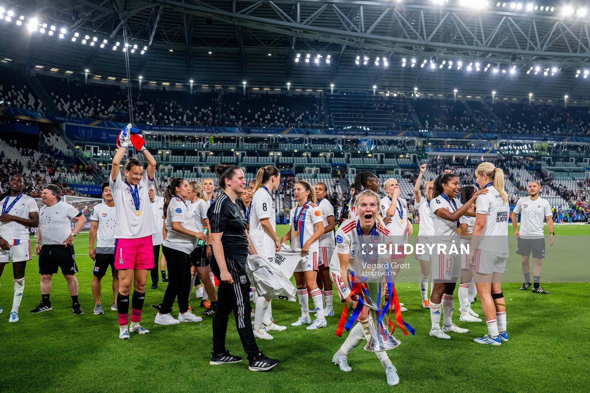 Ada Hegerberg of Lyon celebrates with the winners trophy