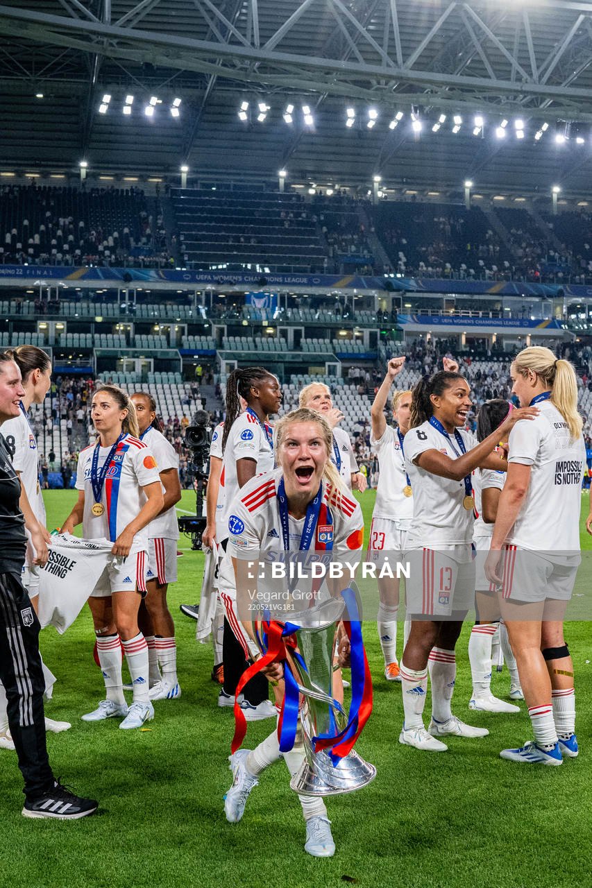 Ada Hegerberg of Lyon celebrates with the winners trophy