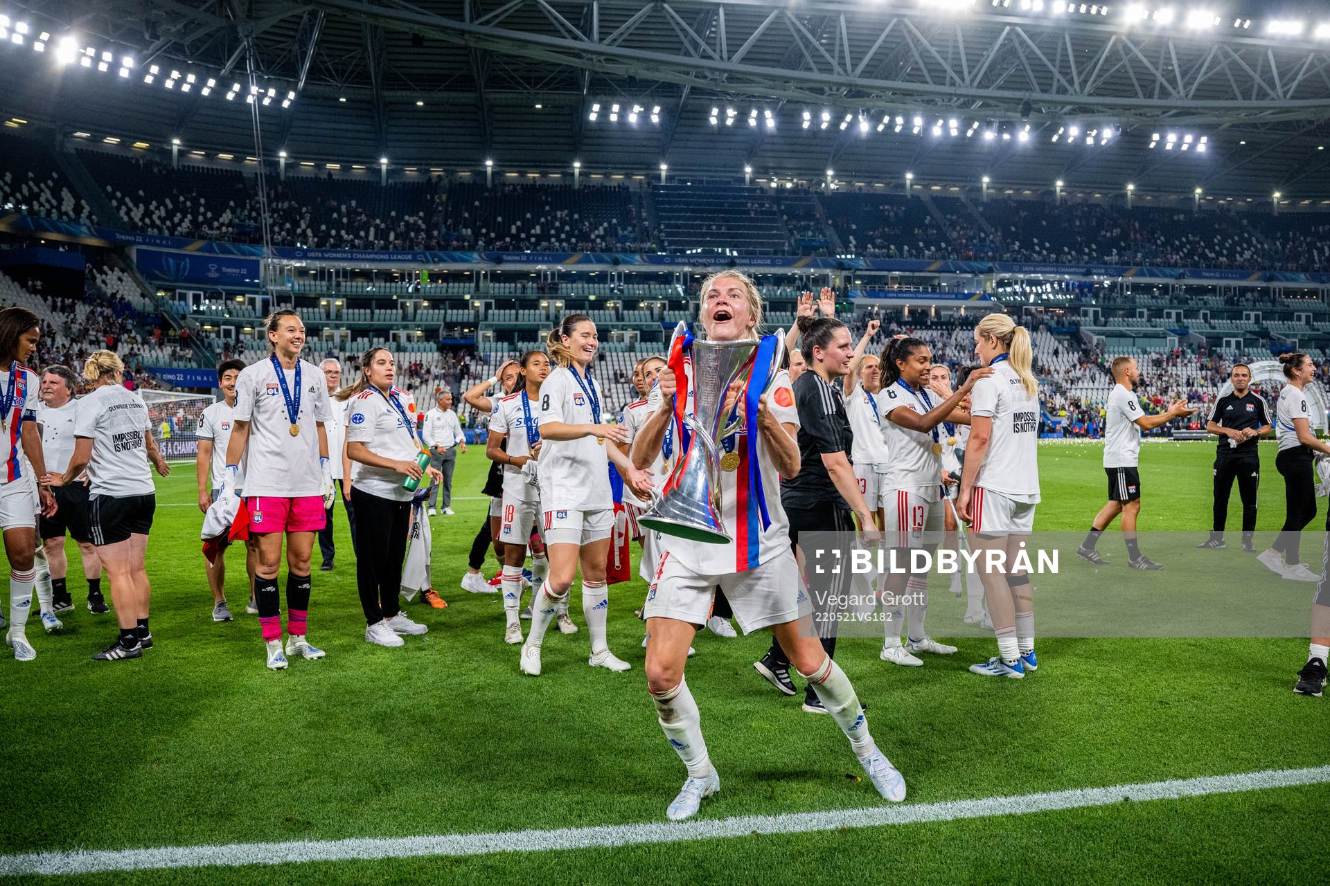Ada Hegerberg of Lyon celebrates with the winners trophy