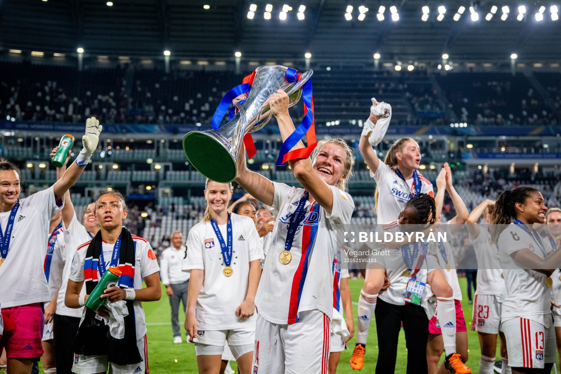 Ada Hegerberg of Lyon celebrates with the winners trophy