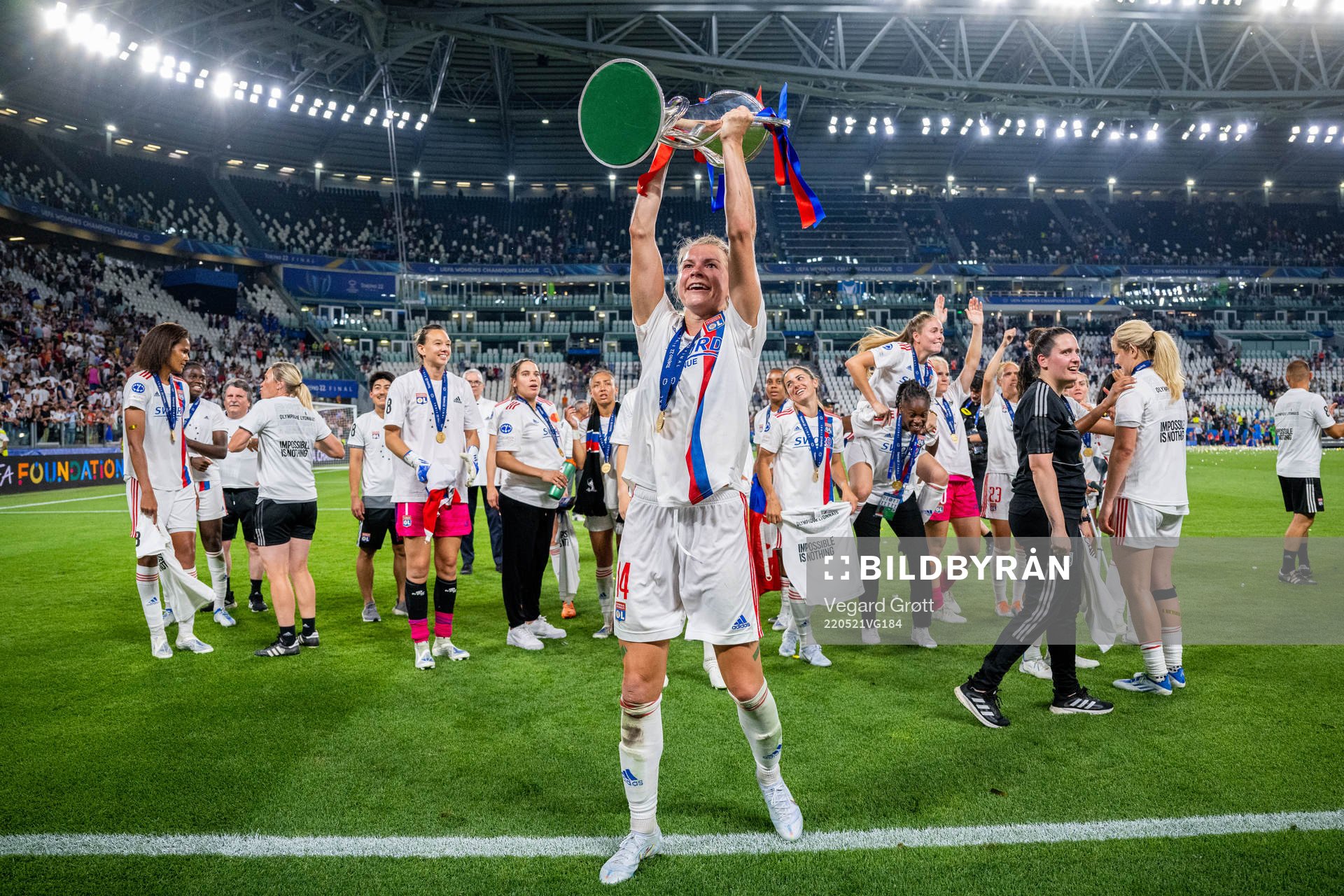 Ada Hegerberg of Lyon celebrates with the winners trophy