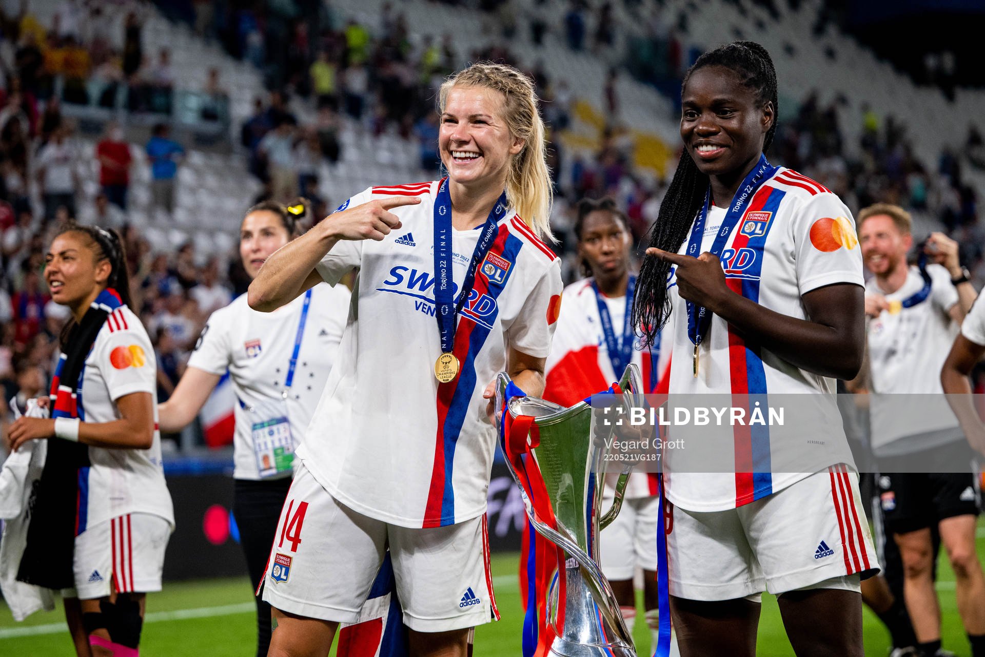 Ada Hegerberg and Griedge Mbock Bathy of Lyon celebrate