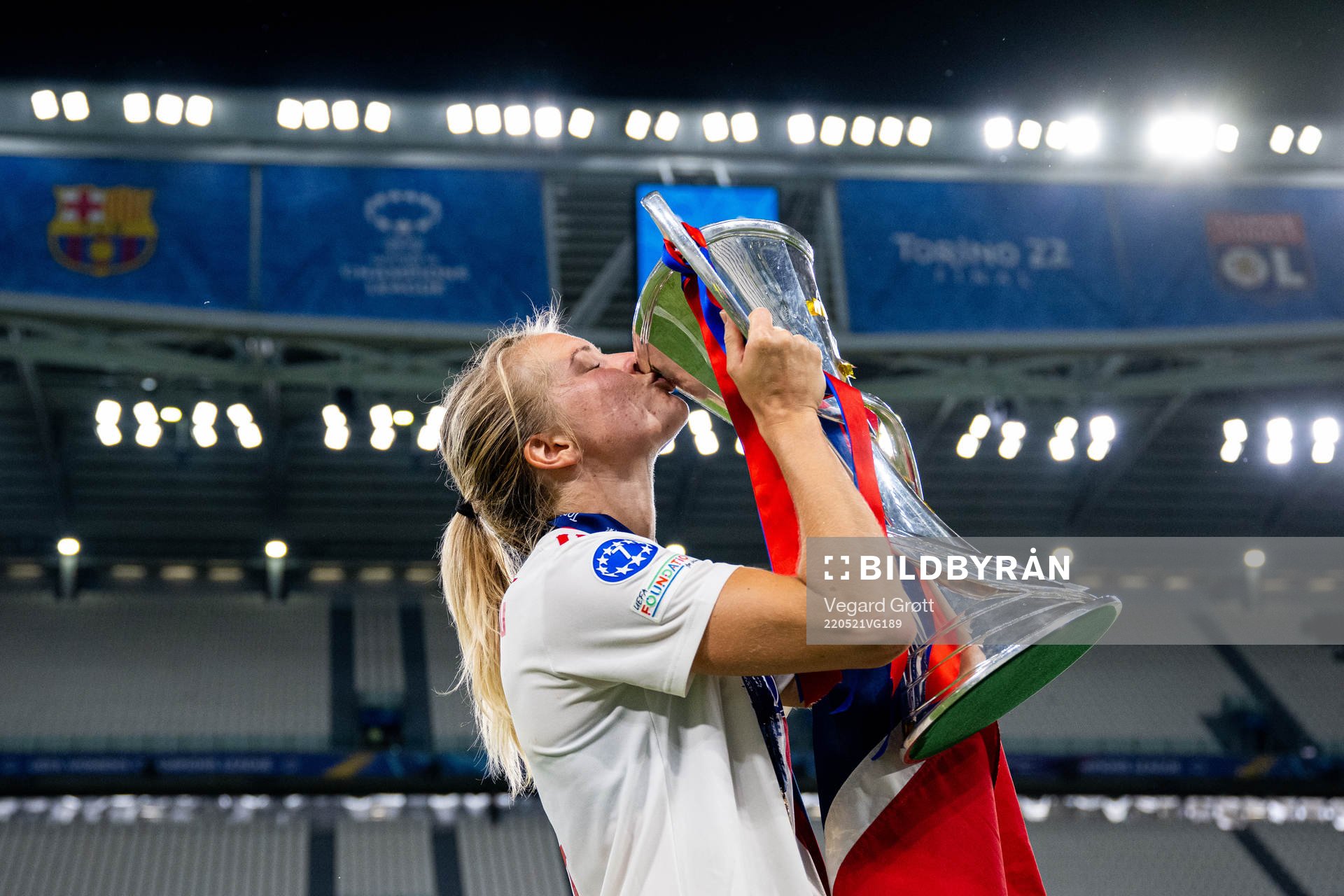 Ada Hegerberg of Lyon kisses the winners trophy