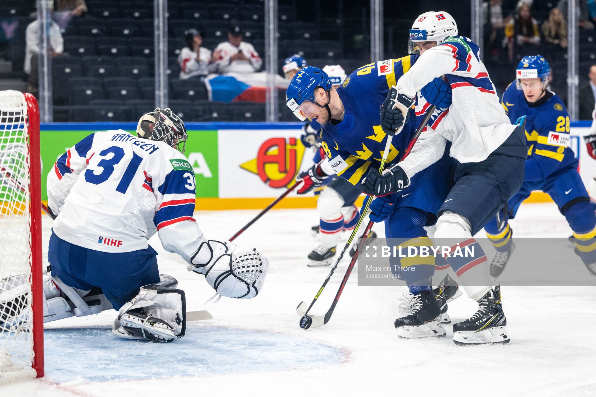 Goaltender Jonas Arntzen of Norway and Carl Klingberg of
