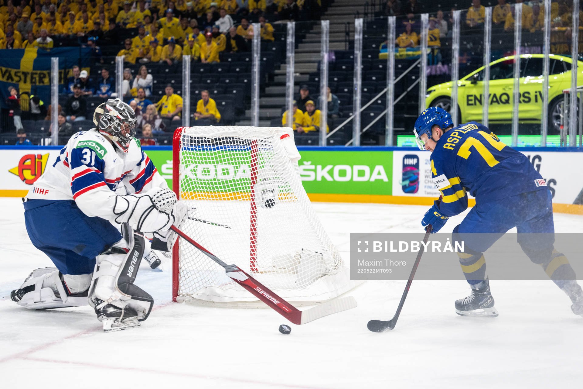 Goaltender Jonas Arntzen of Norway and Rasmus Asplund of