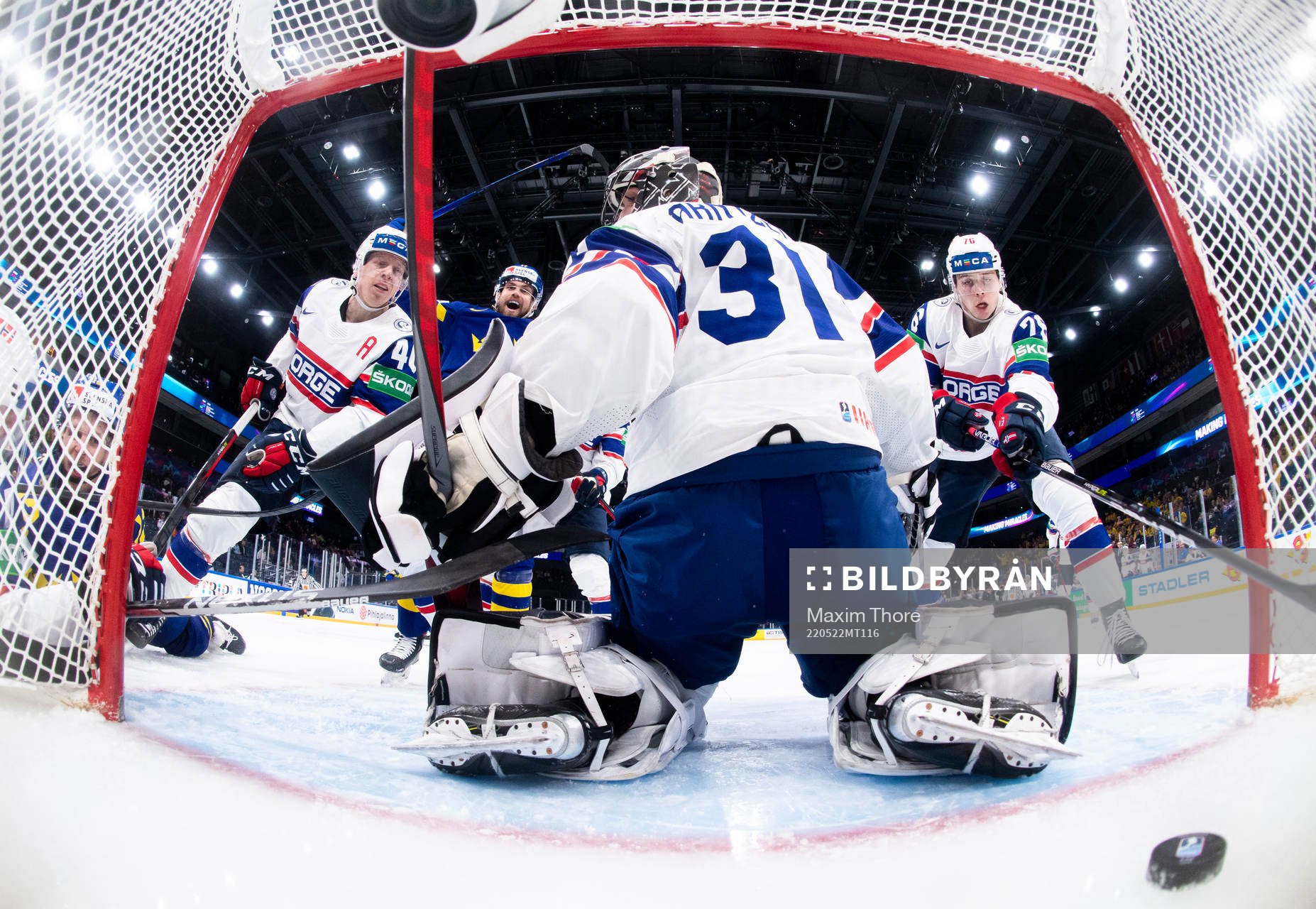 Max Friberg scores the 6-1 goal while Oskar Lang of Sweden