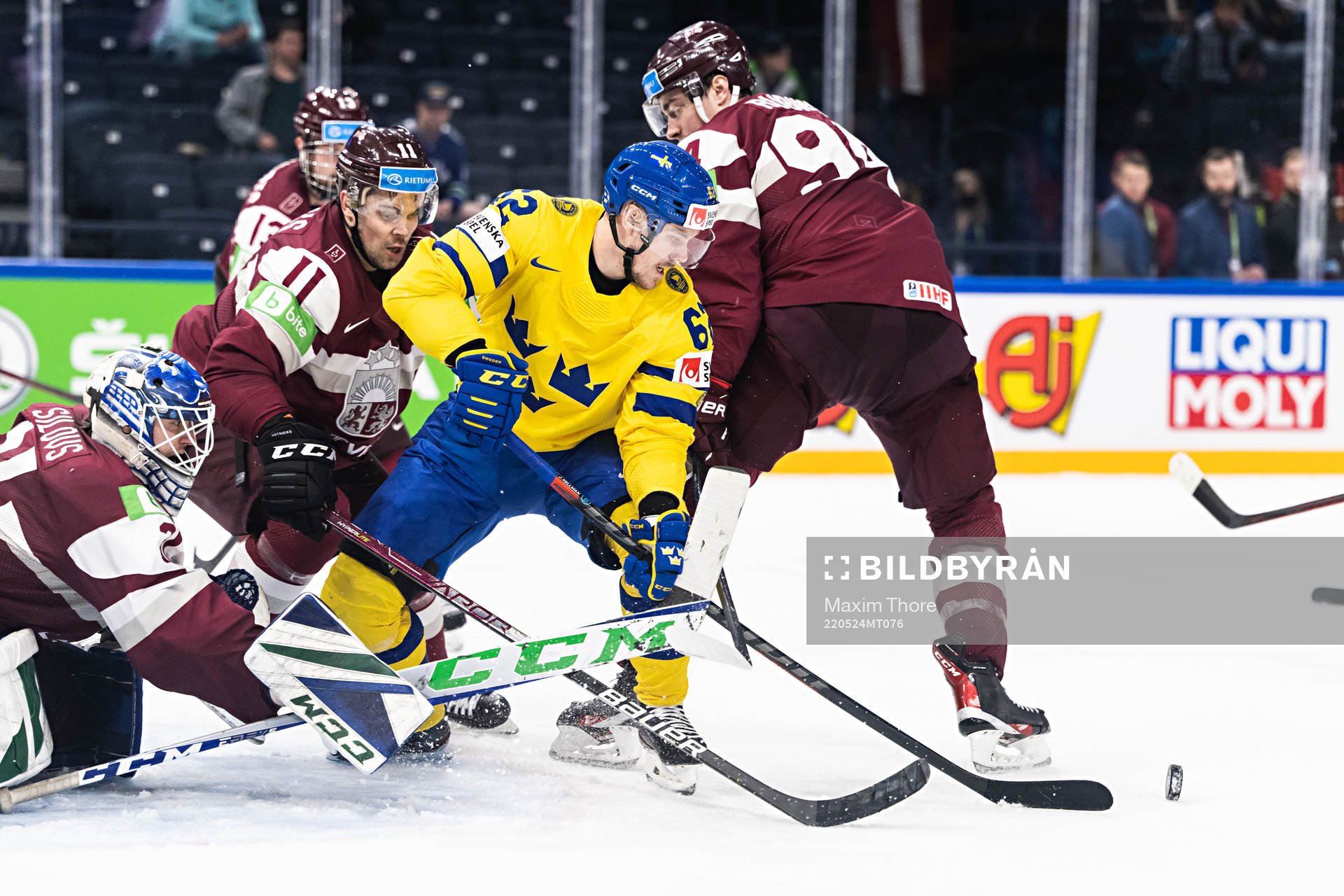 goaltender Arturs Silovs of Latvia and Kristaps Sotnieks