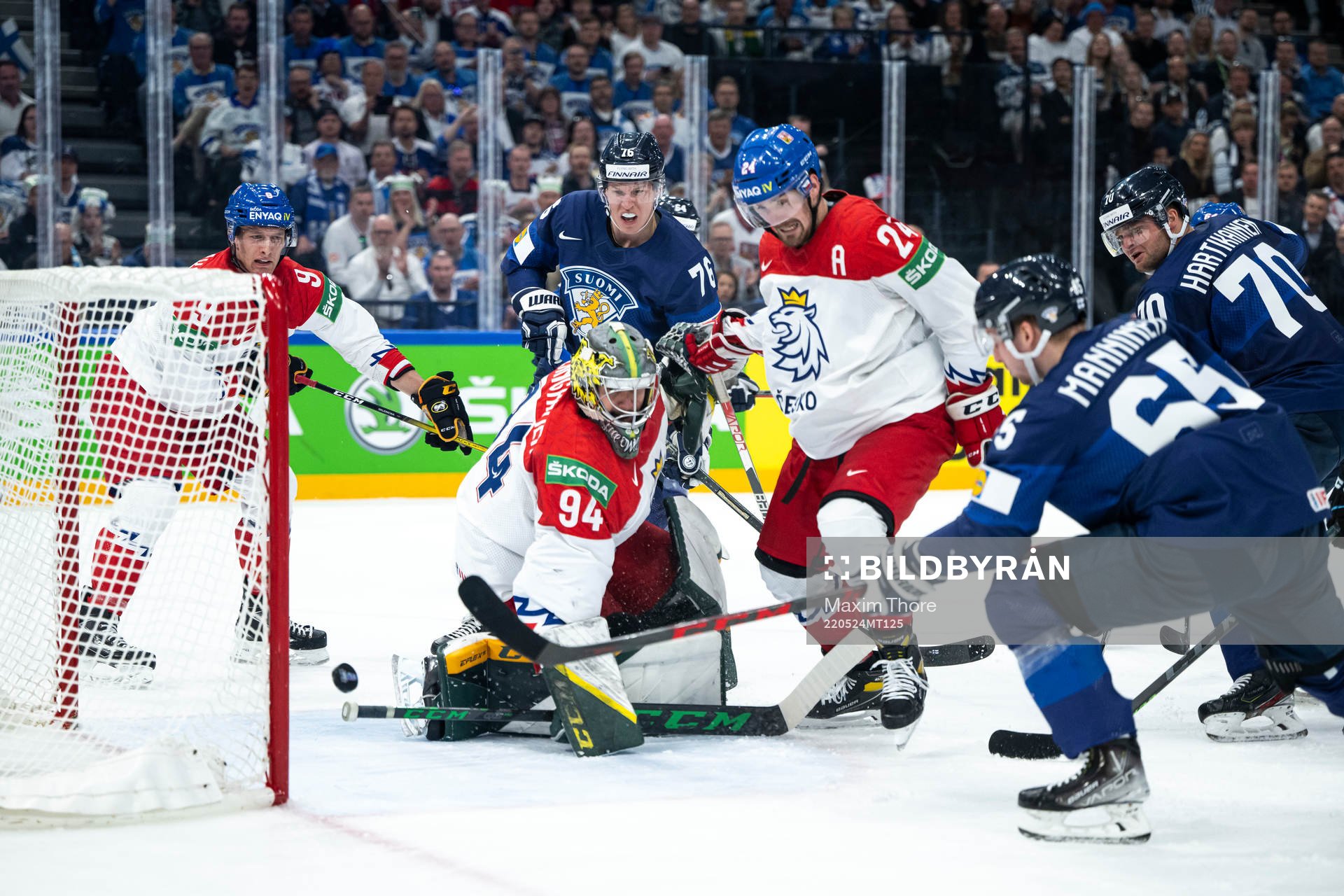 Sakari Manninen of Finland scores the 2-0 goal behind
