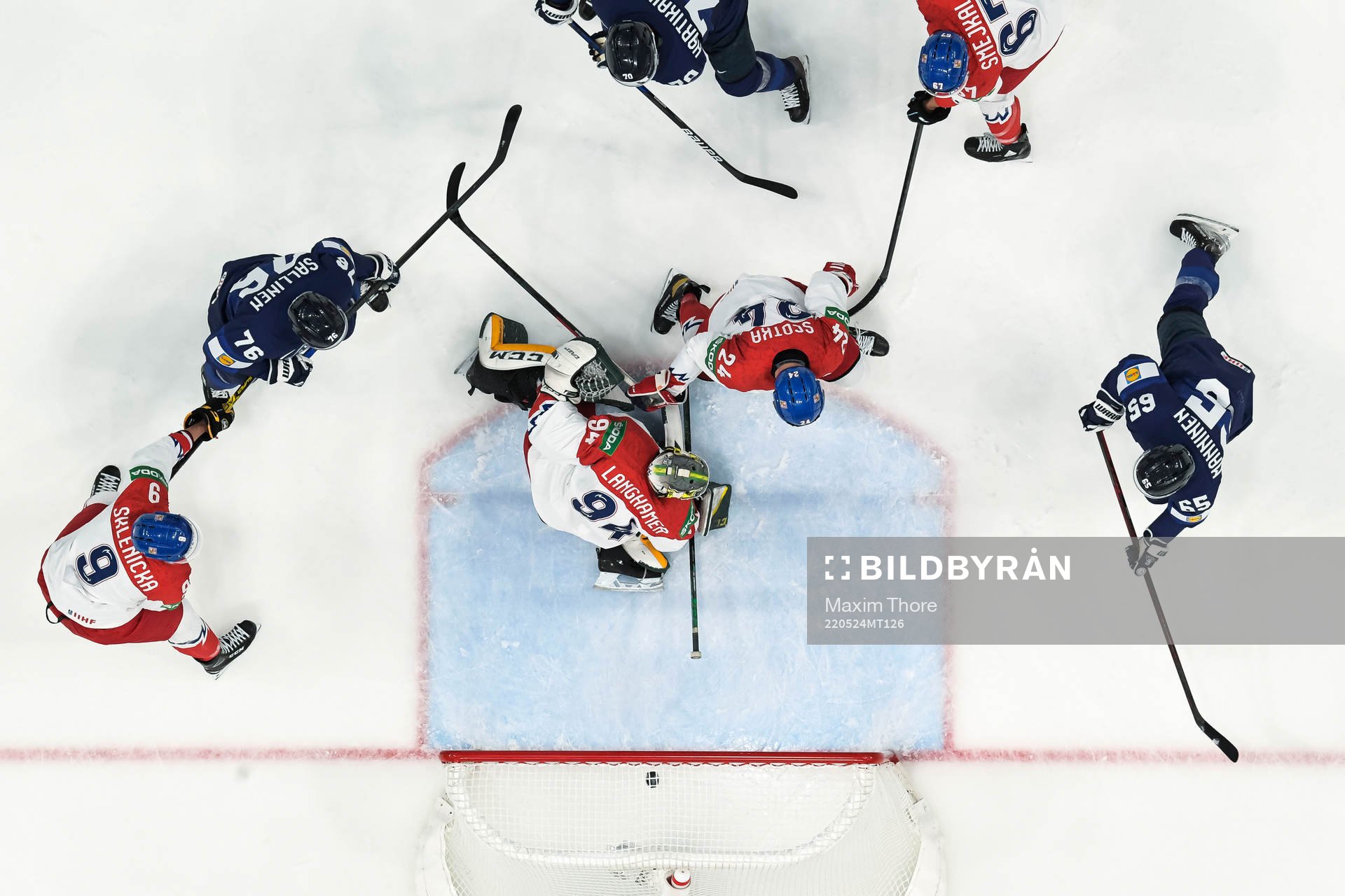 Sakari Manninen of Finland scores the 2-0 goal behind