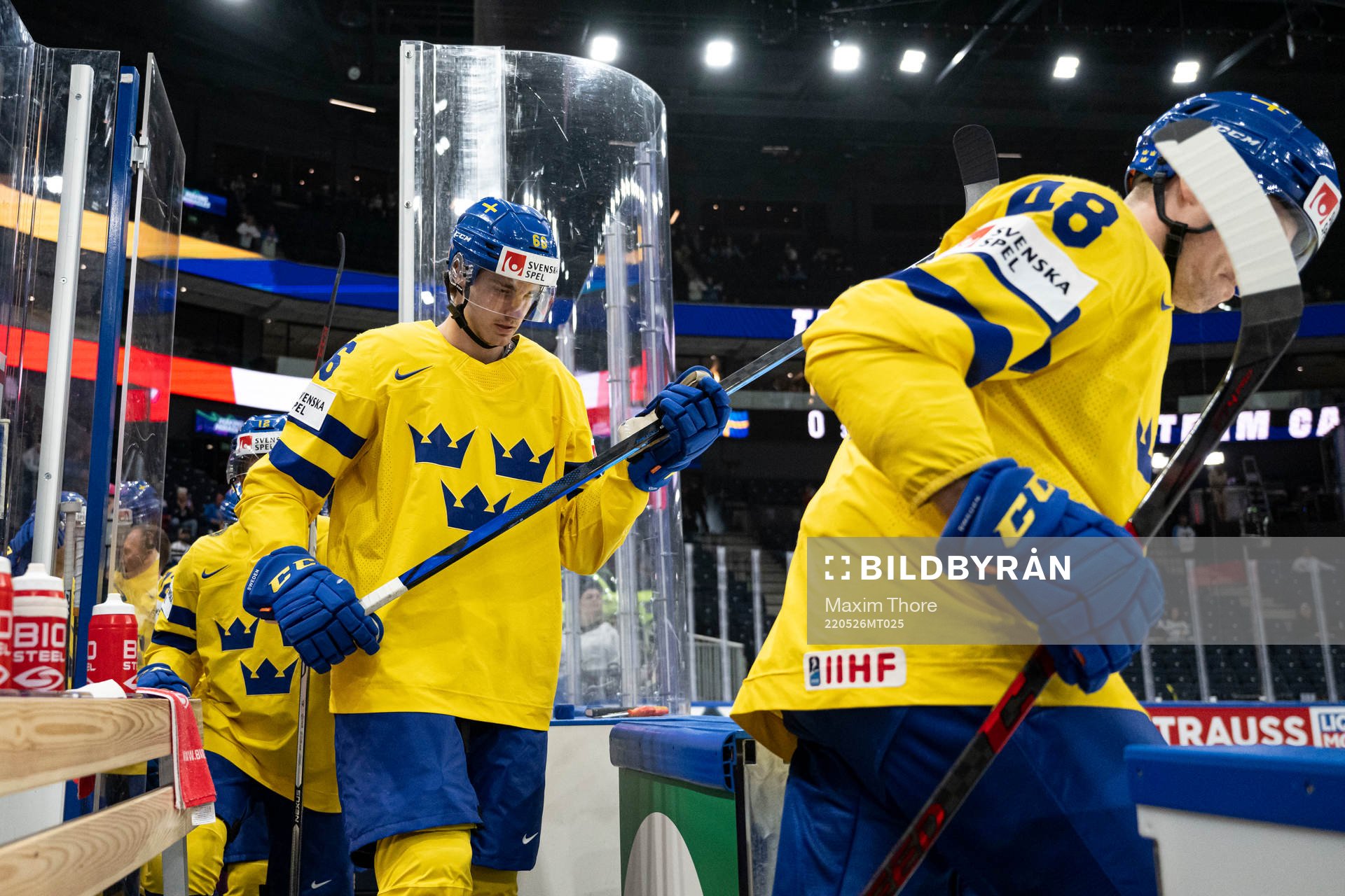 Nils Åman of Sweden enter the ice