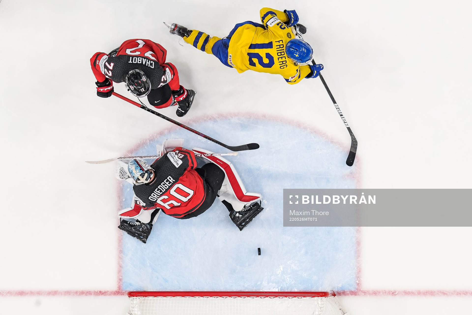 goaltender Chris Driedger and Thomas Chabot of Canada see