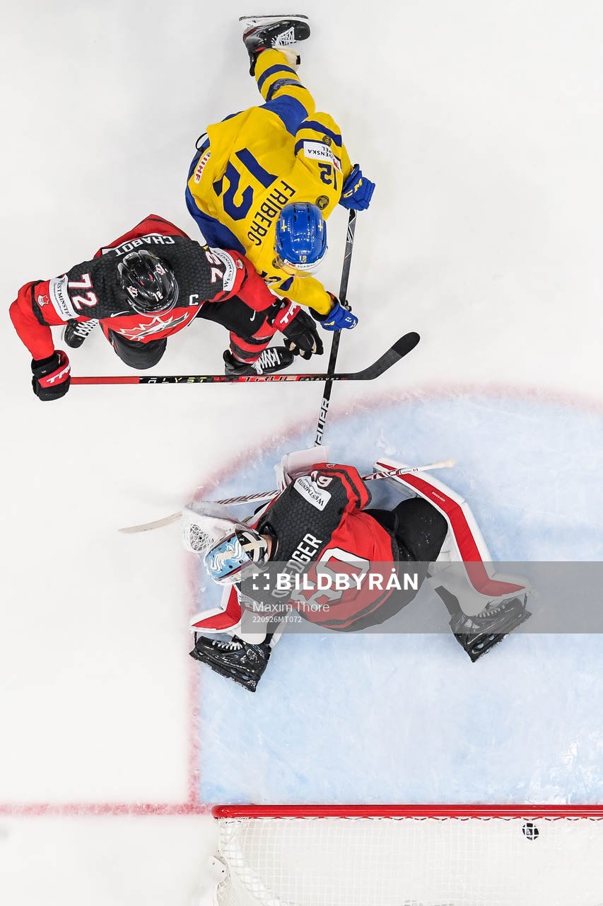goaltender Chris Driedger and Thomas Chabot of Canada as