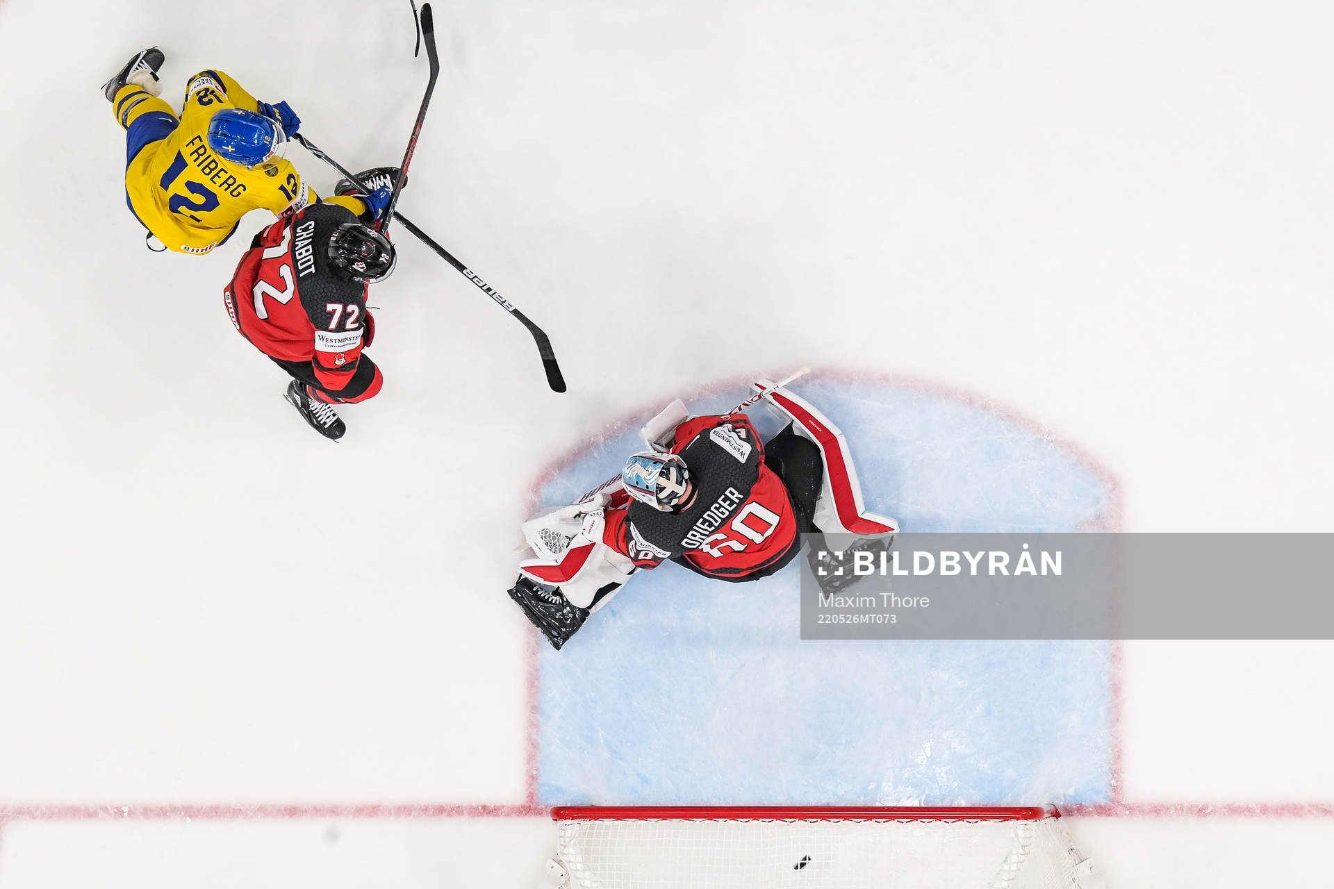 goaltender Chris Driedger and Thomas Chabot of Canada as