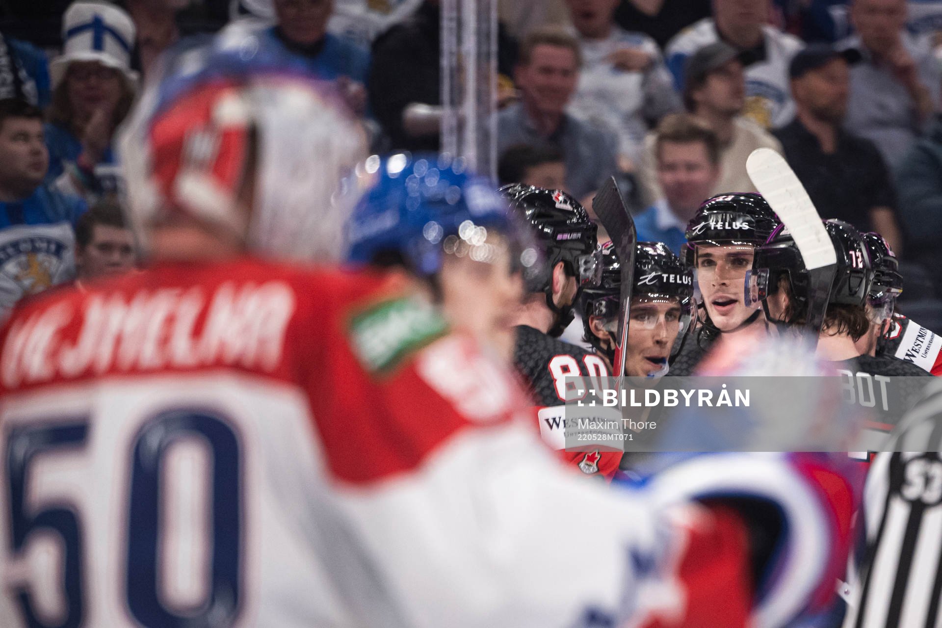 Dylan Cozens of Canada celebrate with teammates