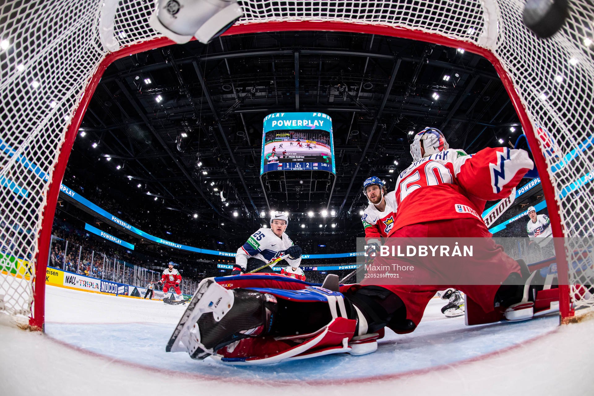 Karson Kaulman of USA scores the 1-3 goal behind goaltender
